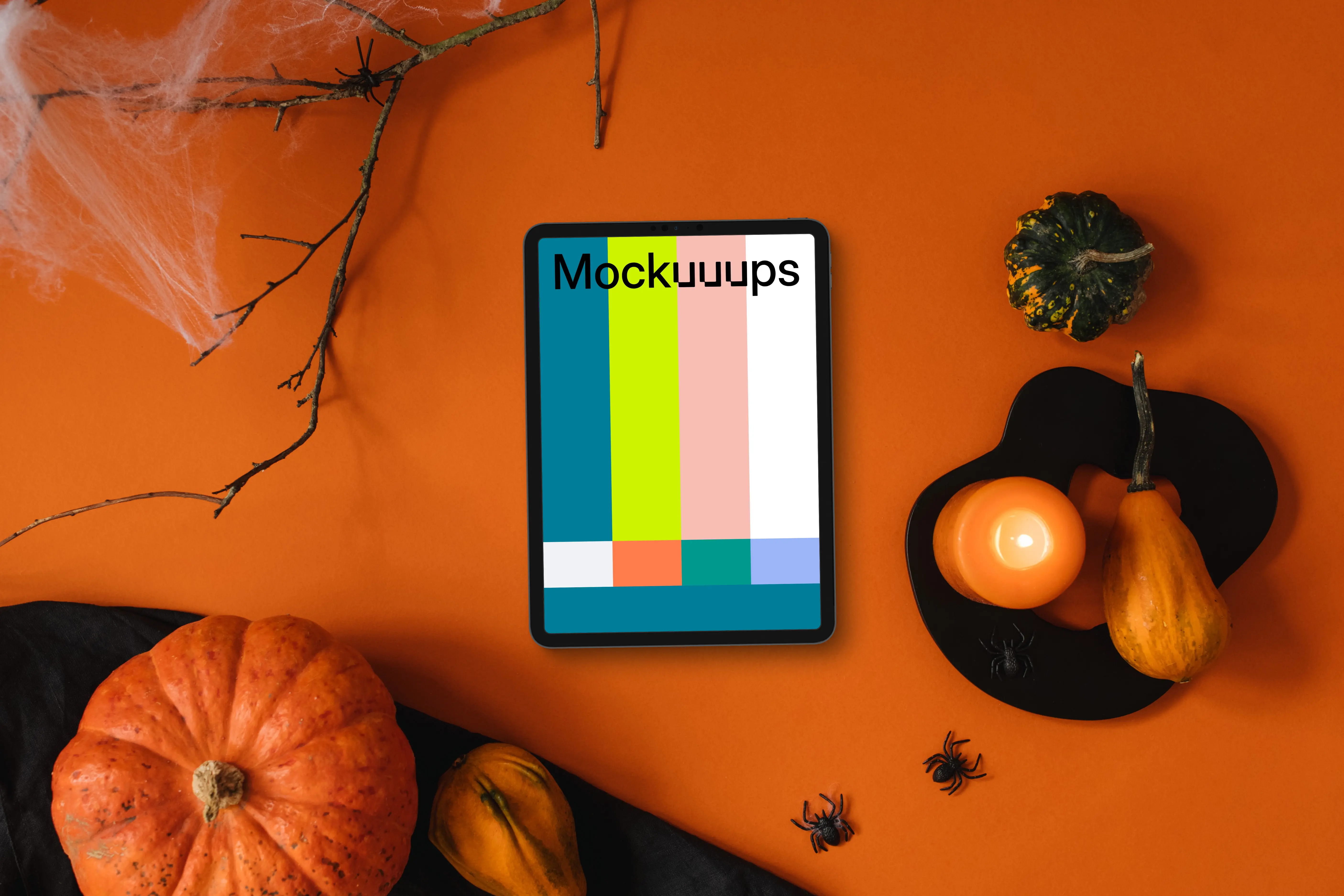 Halloween background mockup with a tablet and spiders