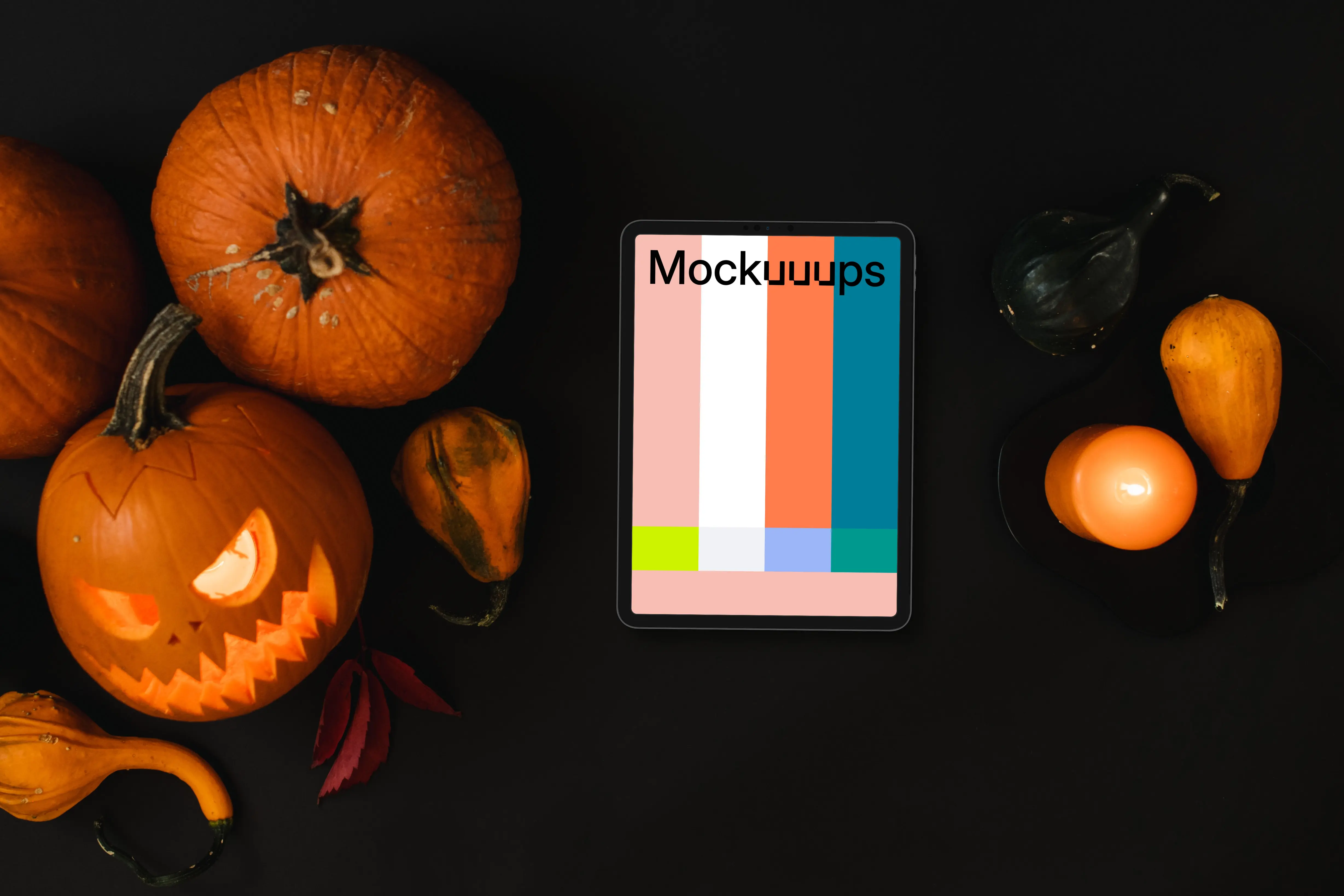 Halloween pumpkin mockup with a tablet and candles