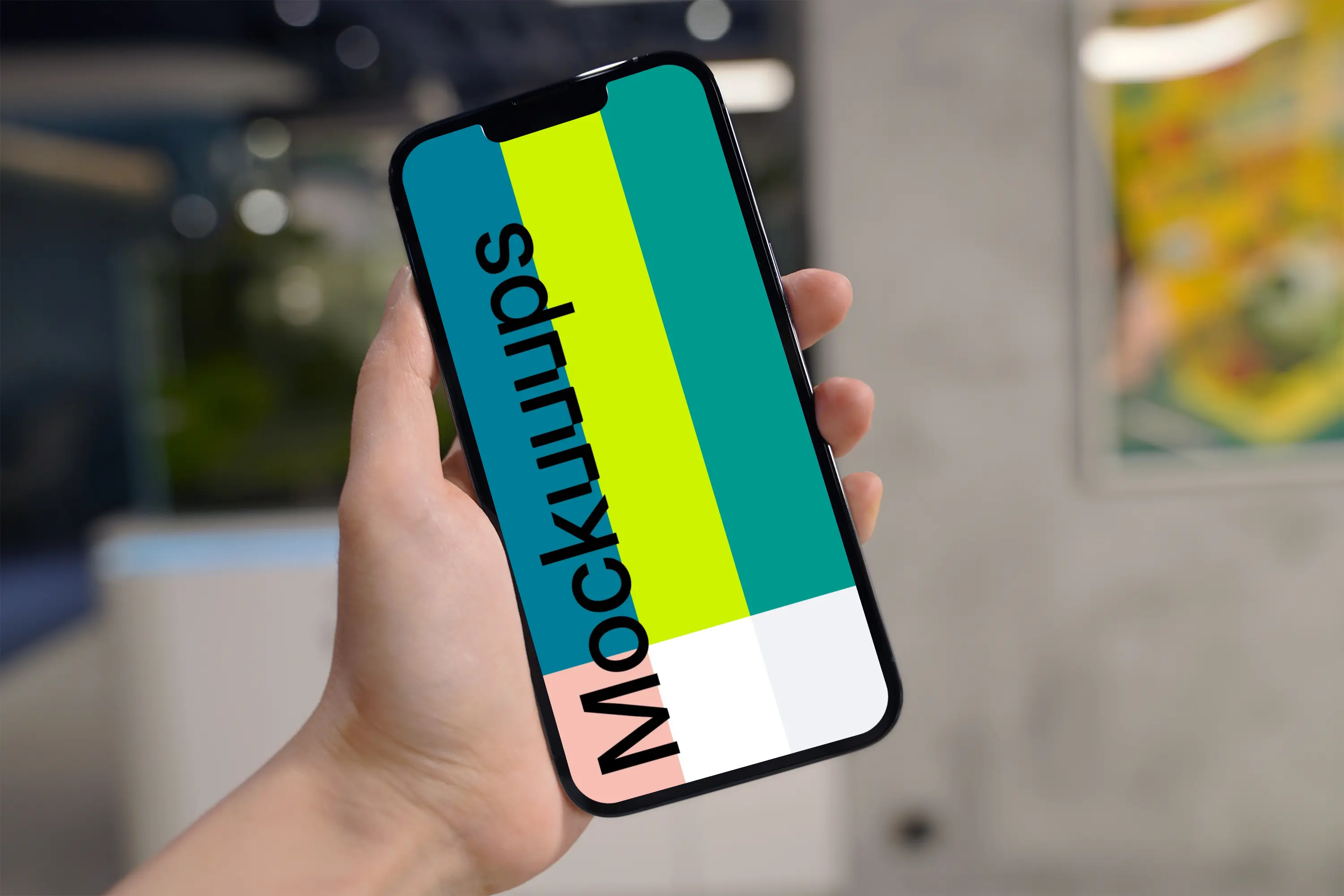 Hand holding an iPhone 13 Pro mockup