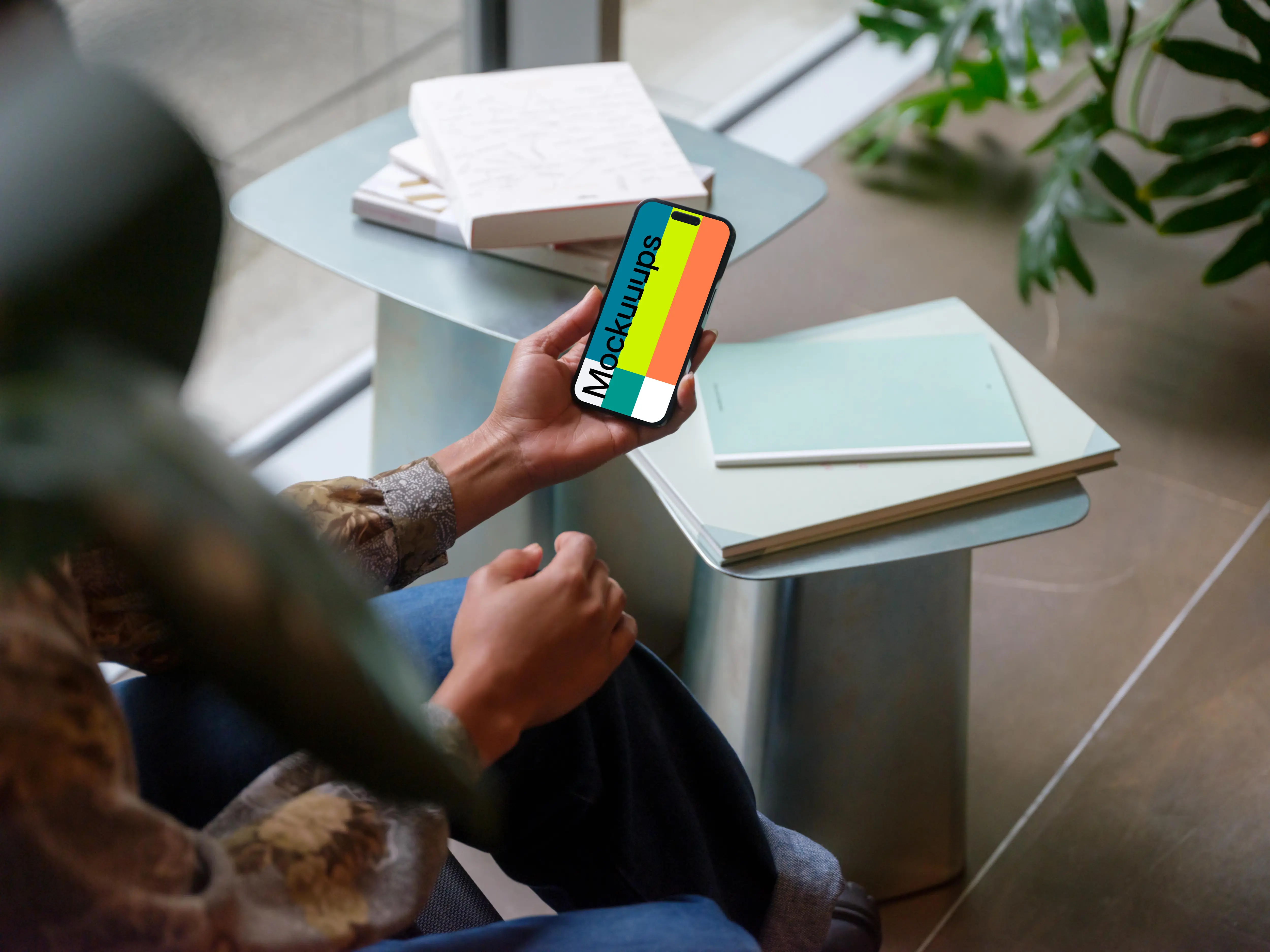 Hand holding an iPhone 14 Pro mockup