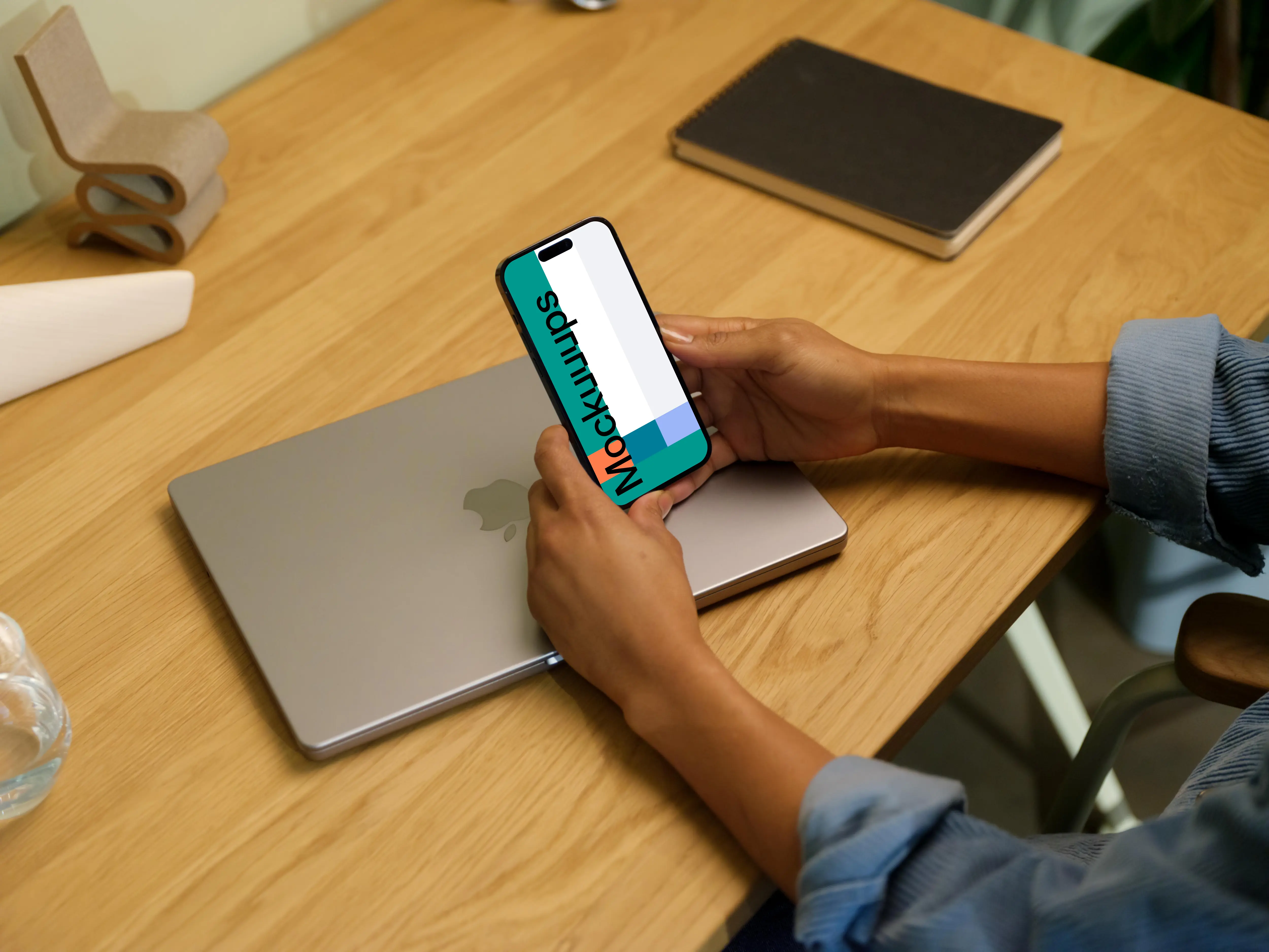 Hands holding an iPhone 14 Pro mockup