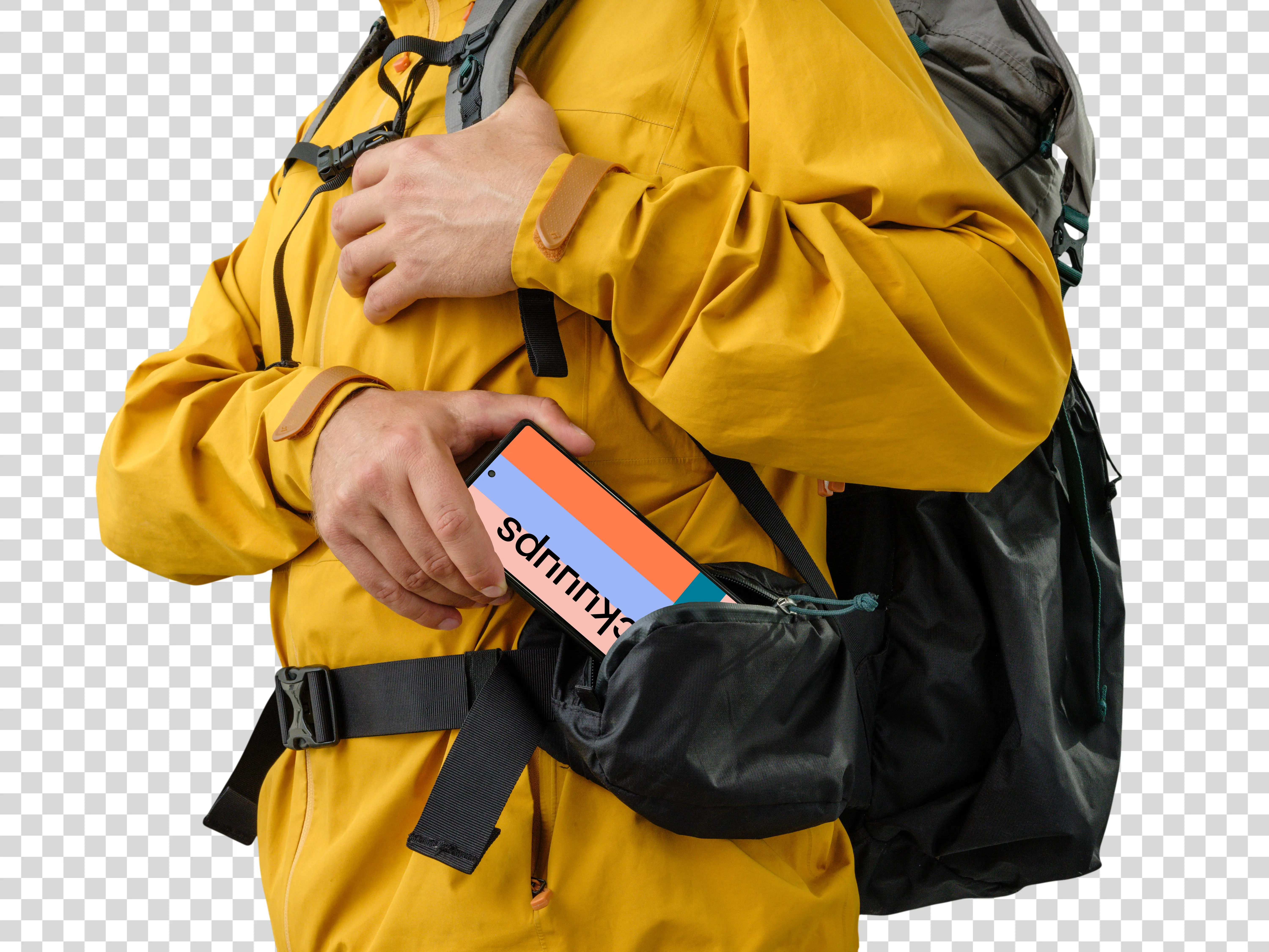 Hiker dressed in yellow holding a Google Pixel mockup