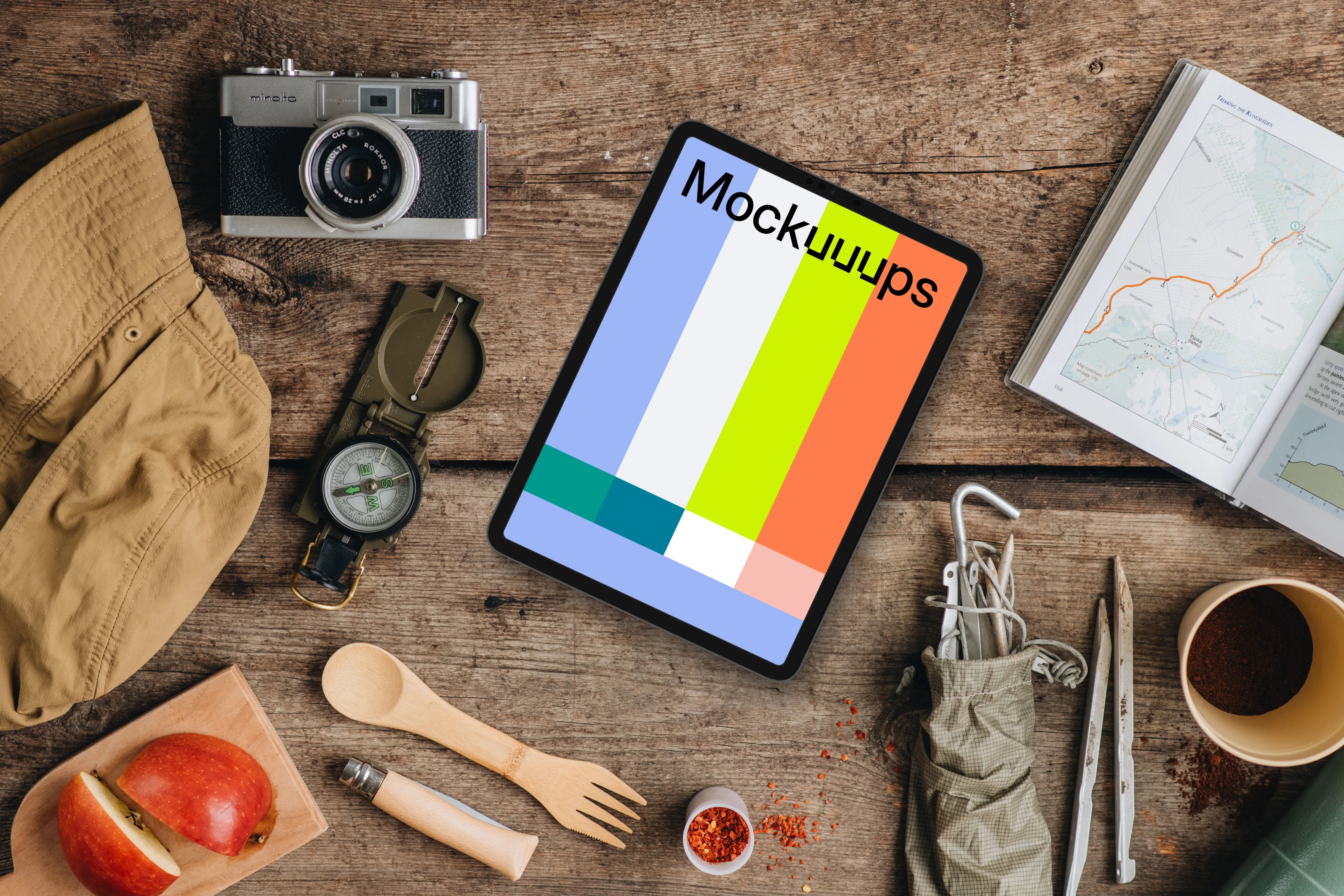 Hiking trip supplies around tablet mockup