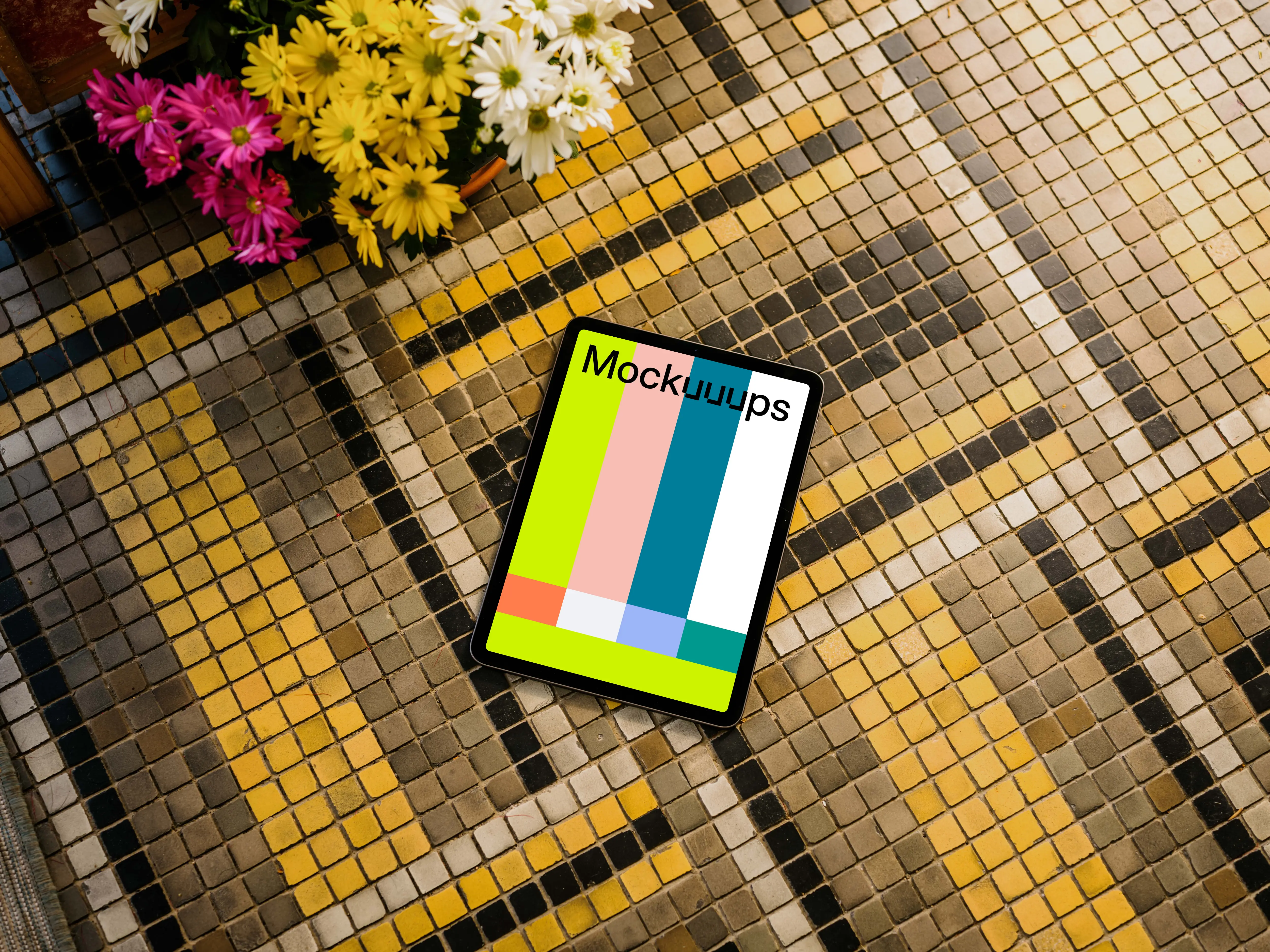 iPad Air mockup on a colorful garden paving with flowers