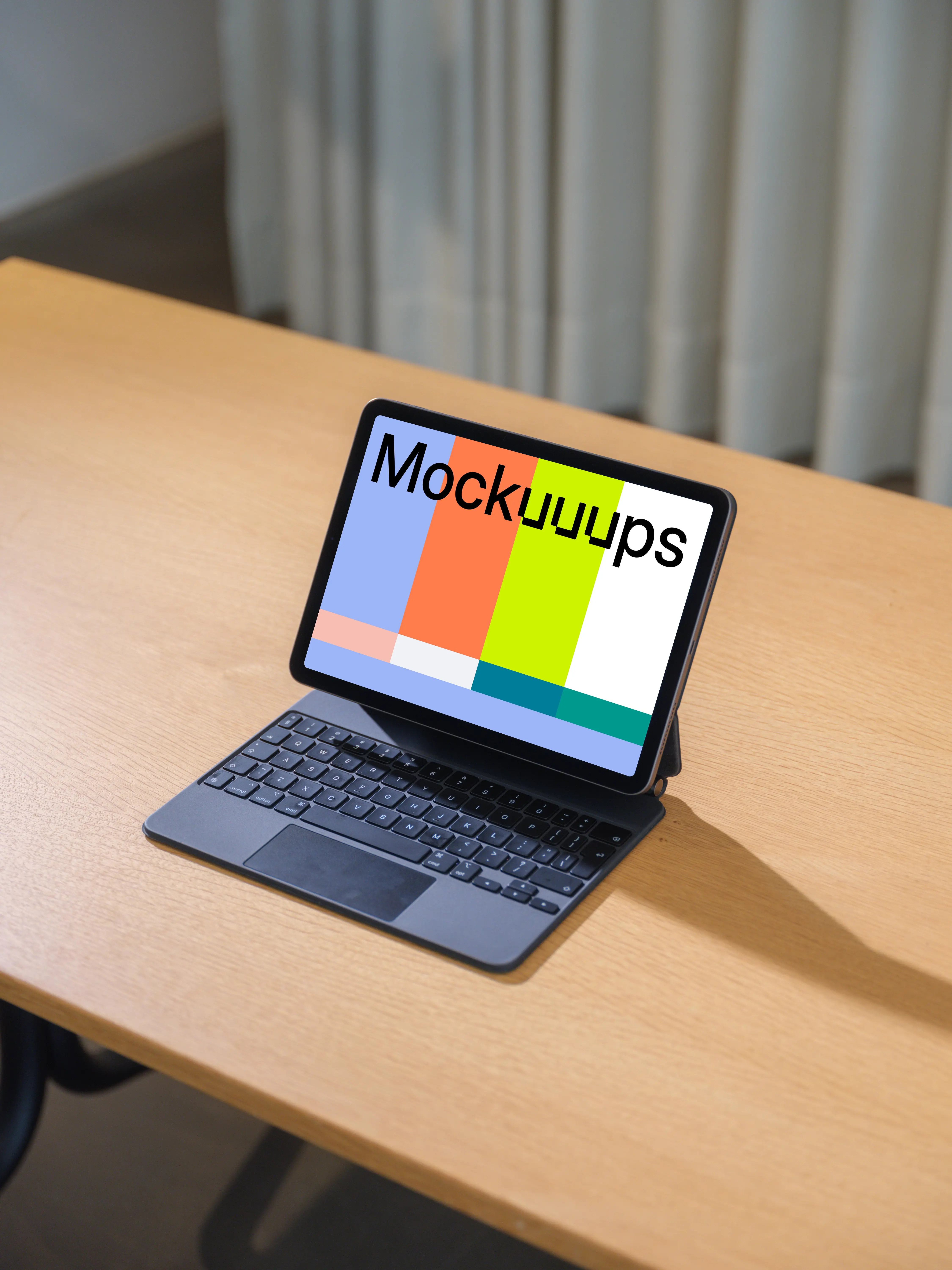 iPad Air mockup on wooden desk with keyboard