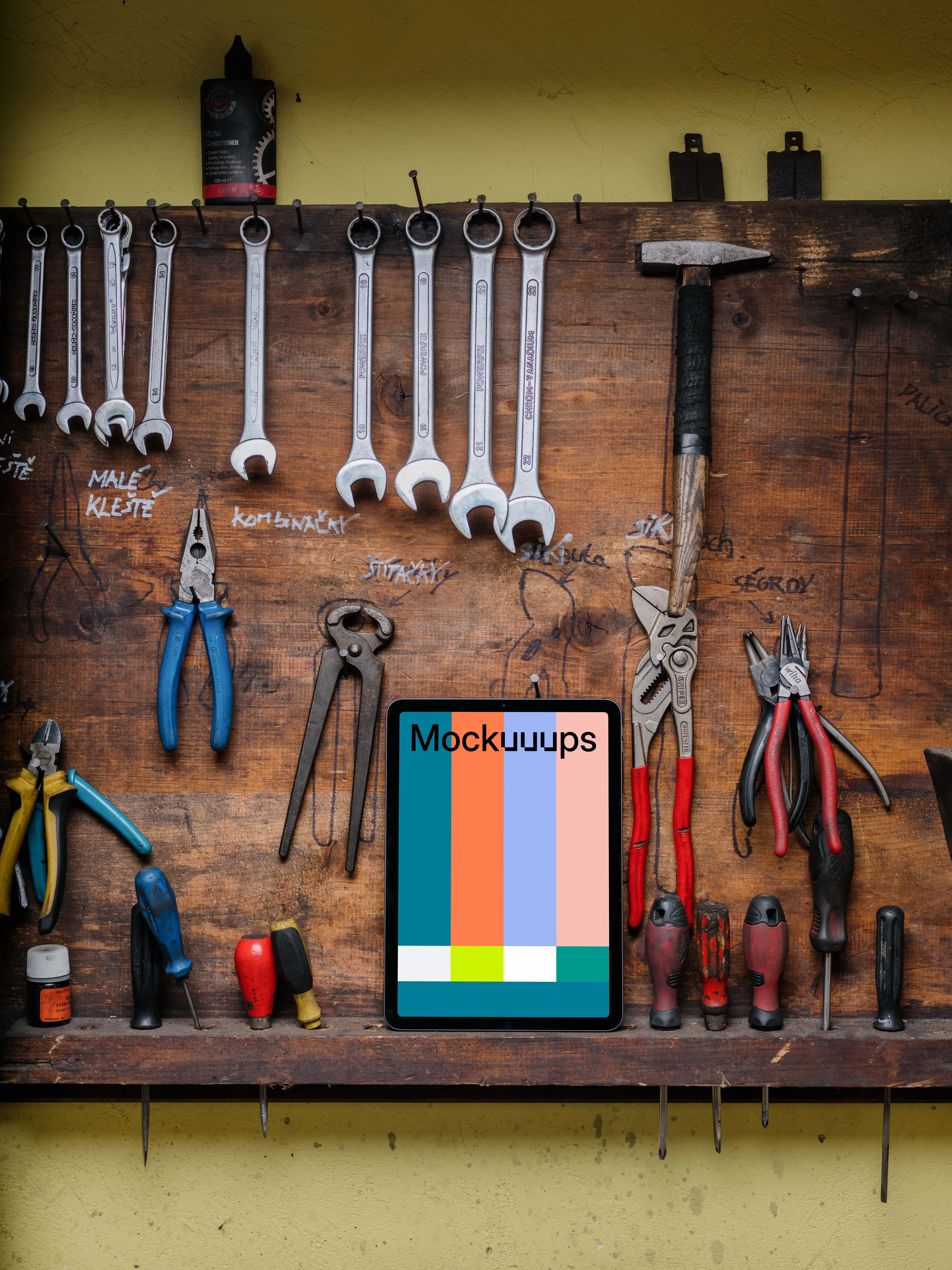iPad Air mockup placed next to some work tools