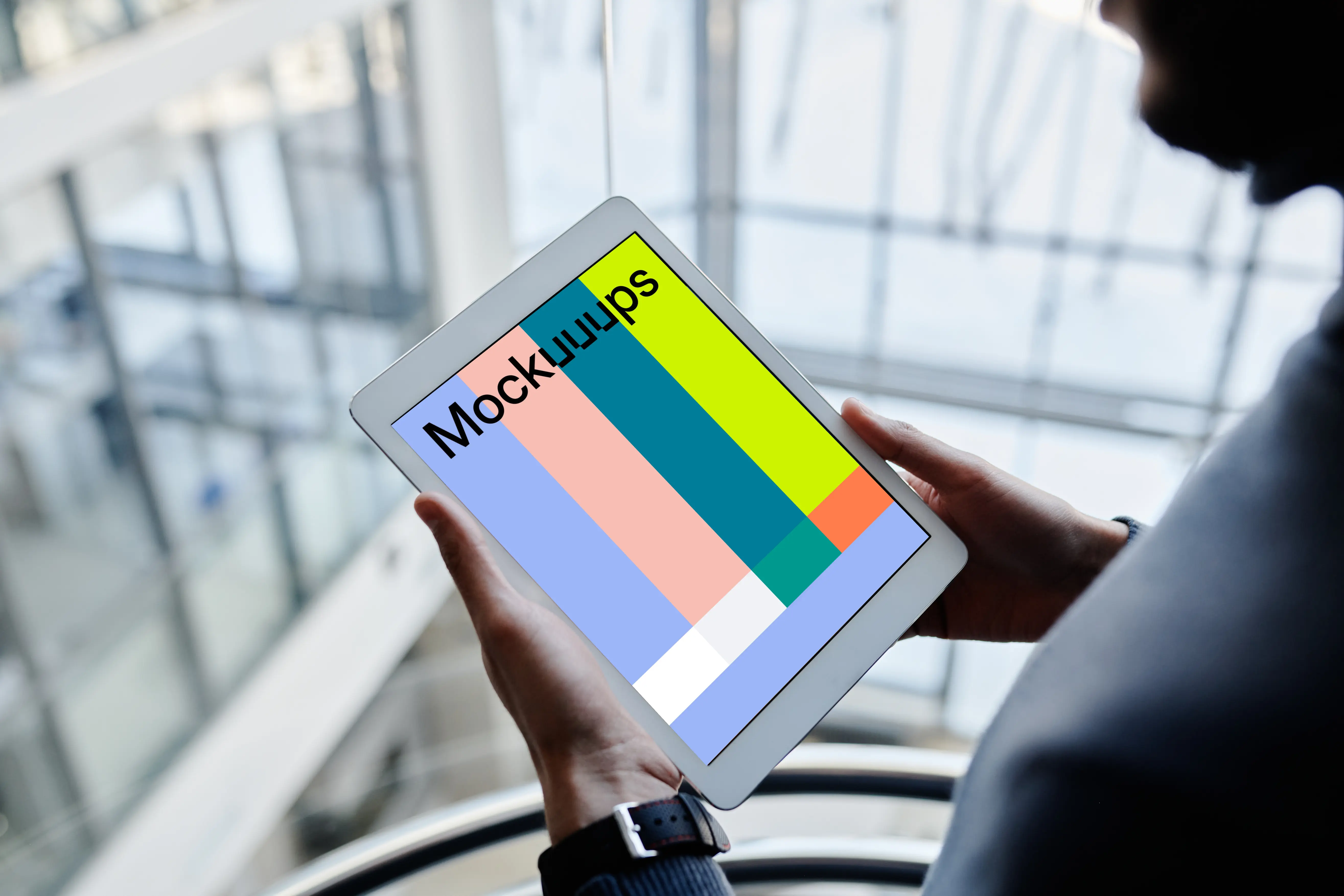 iPad Mini mockup held by male user