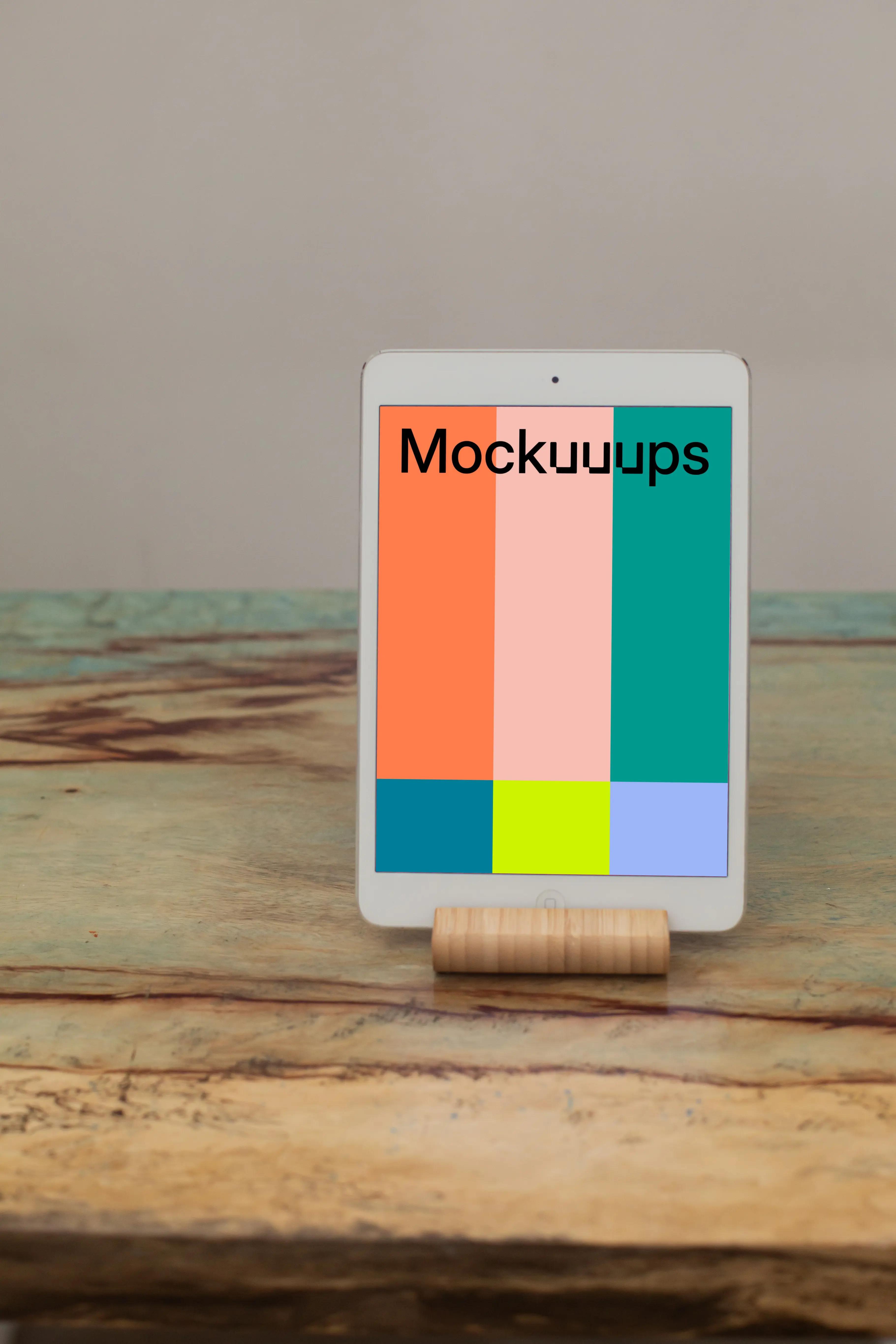iPad Mini mockup placed on a wooden stand in potrait mode