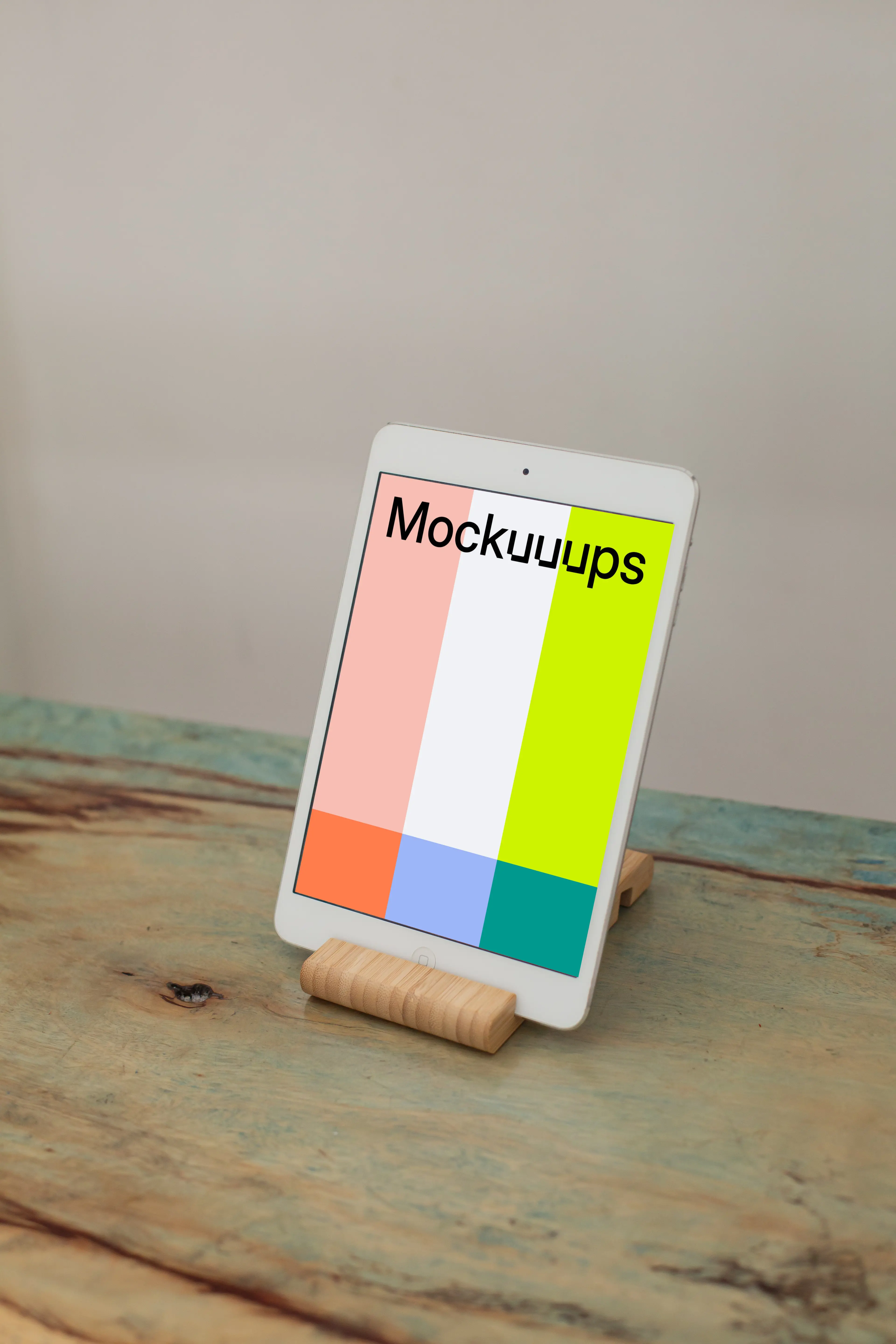 iPad Mini mockup placed on a wooden table in portrait mode