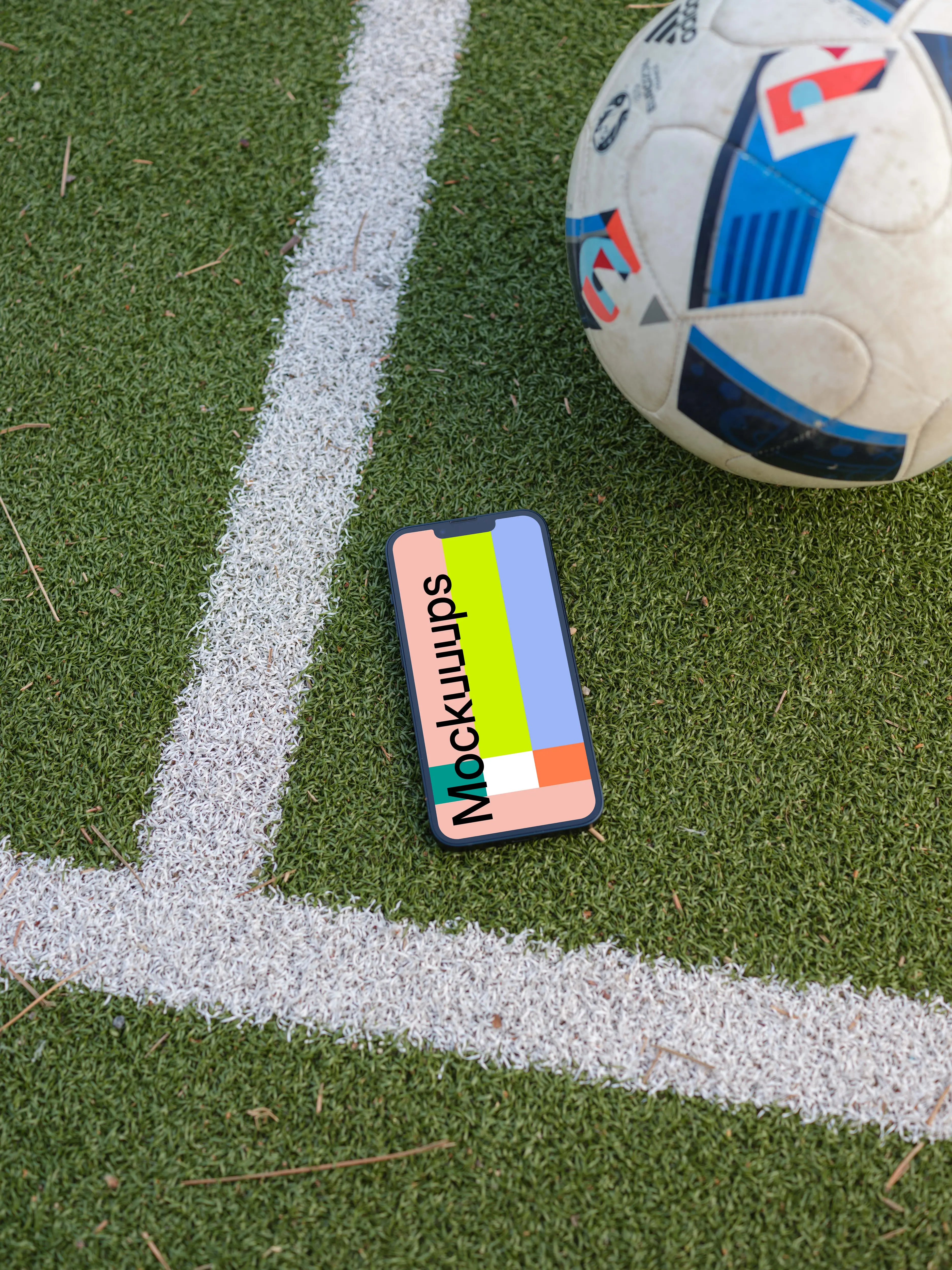 iPhone 13 mockup on the grass