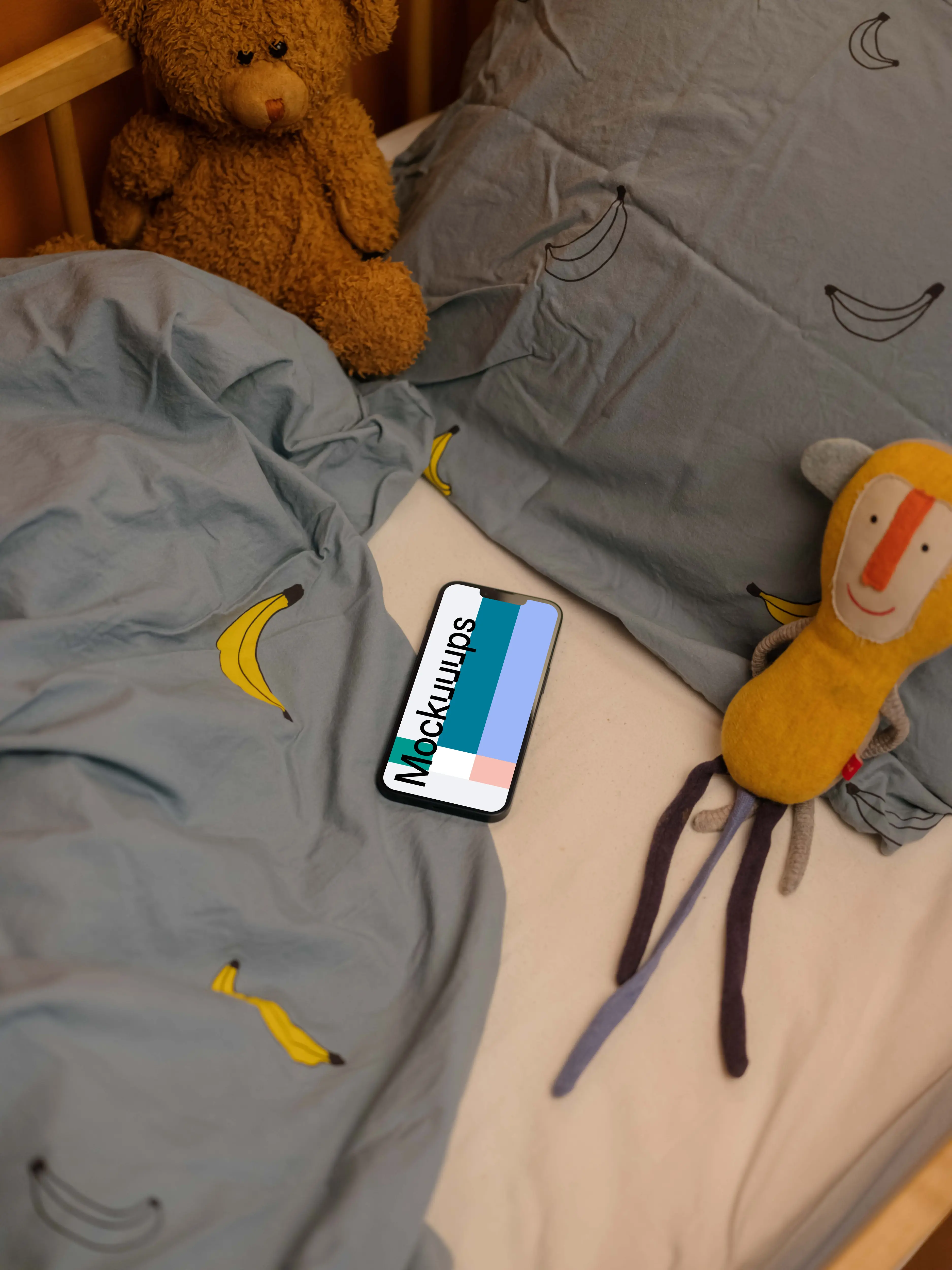 iPhone 13 mockup with stuffed animals