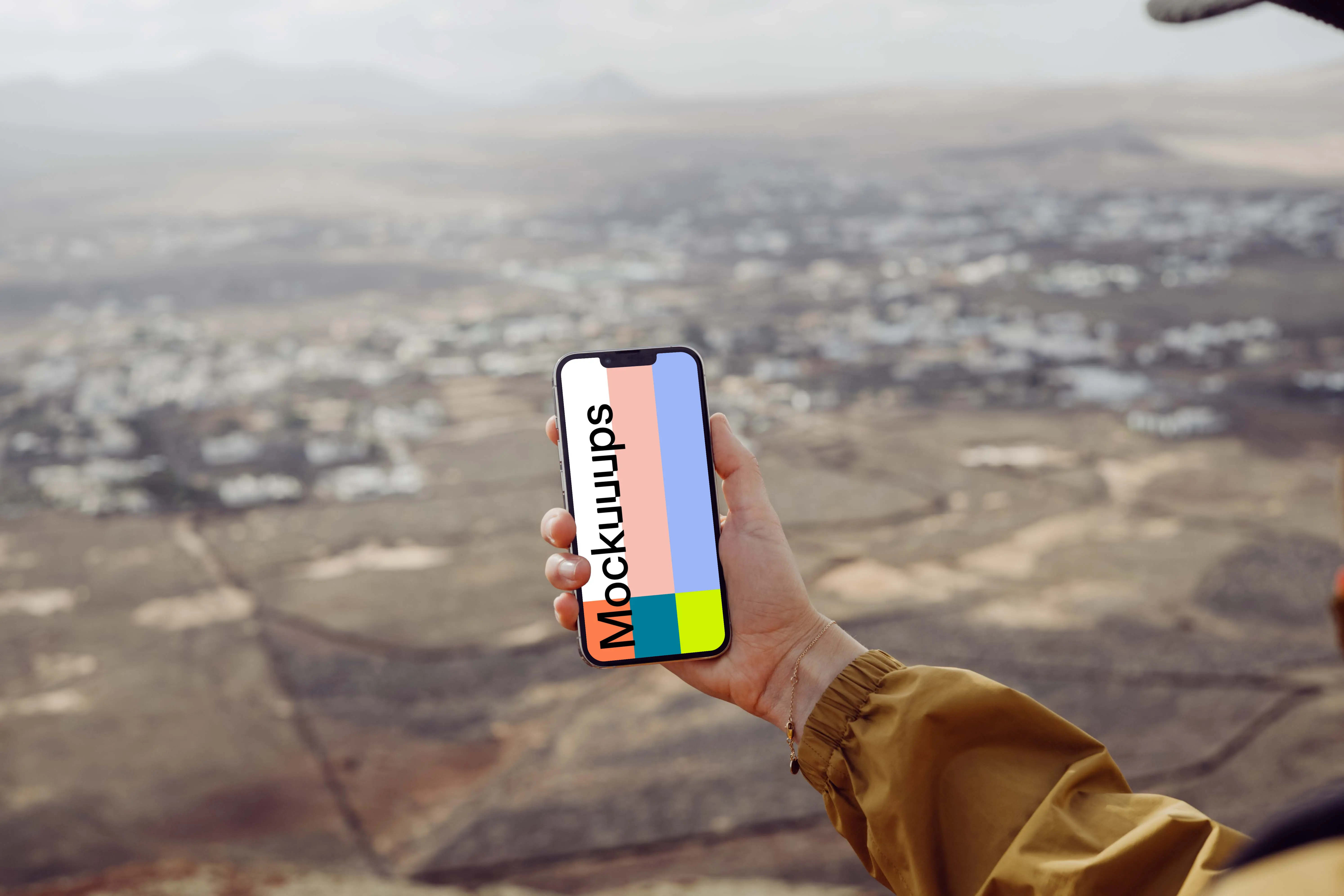 iPhone 13 Pro mockup held by a user above a field