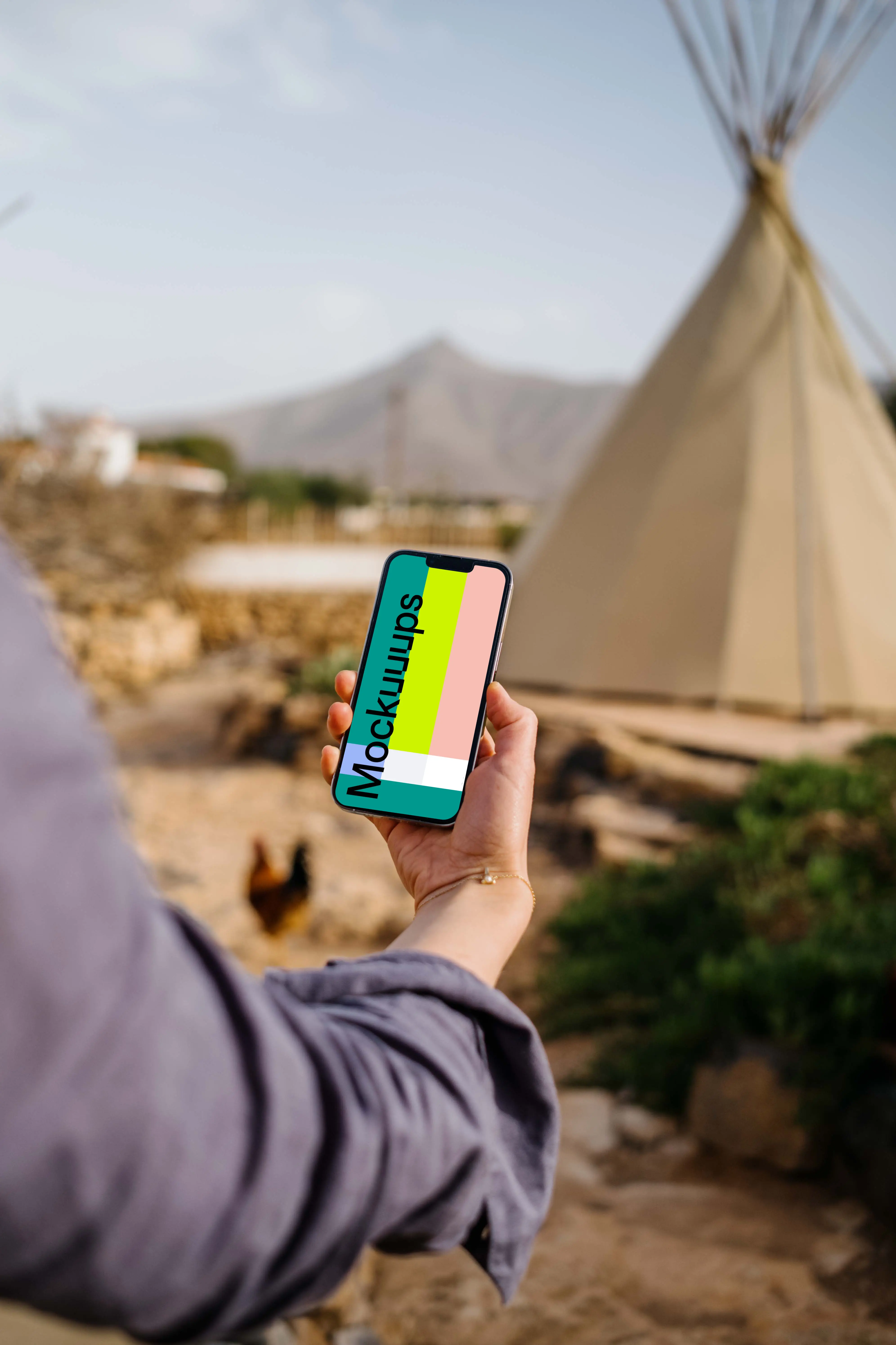 iPhone 13 Pro mockup held by a user