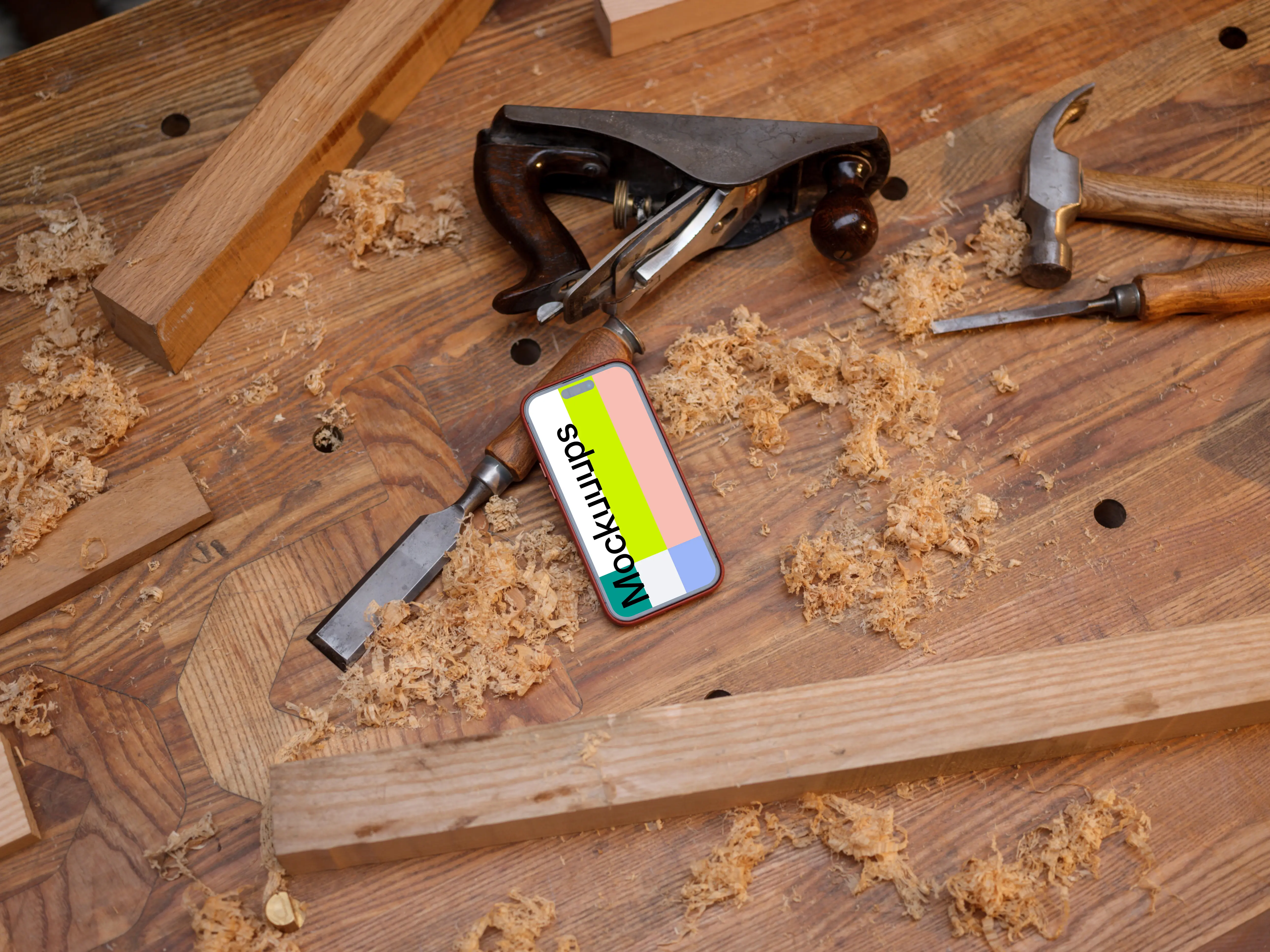 iPhone 14 Pro surrounded by carpentry tools