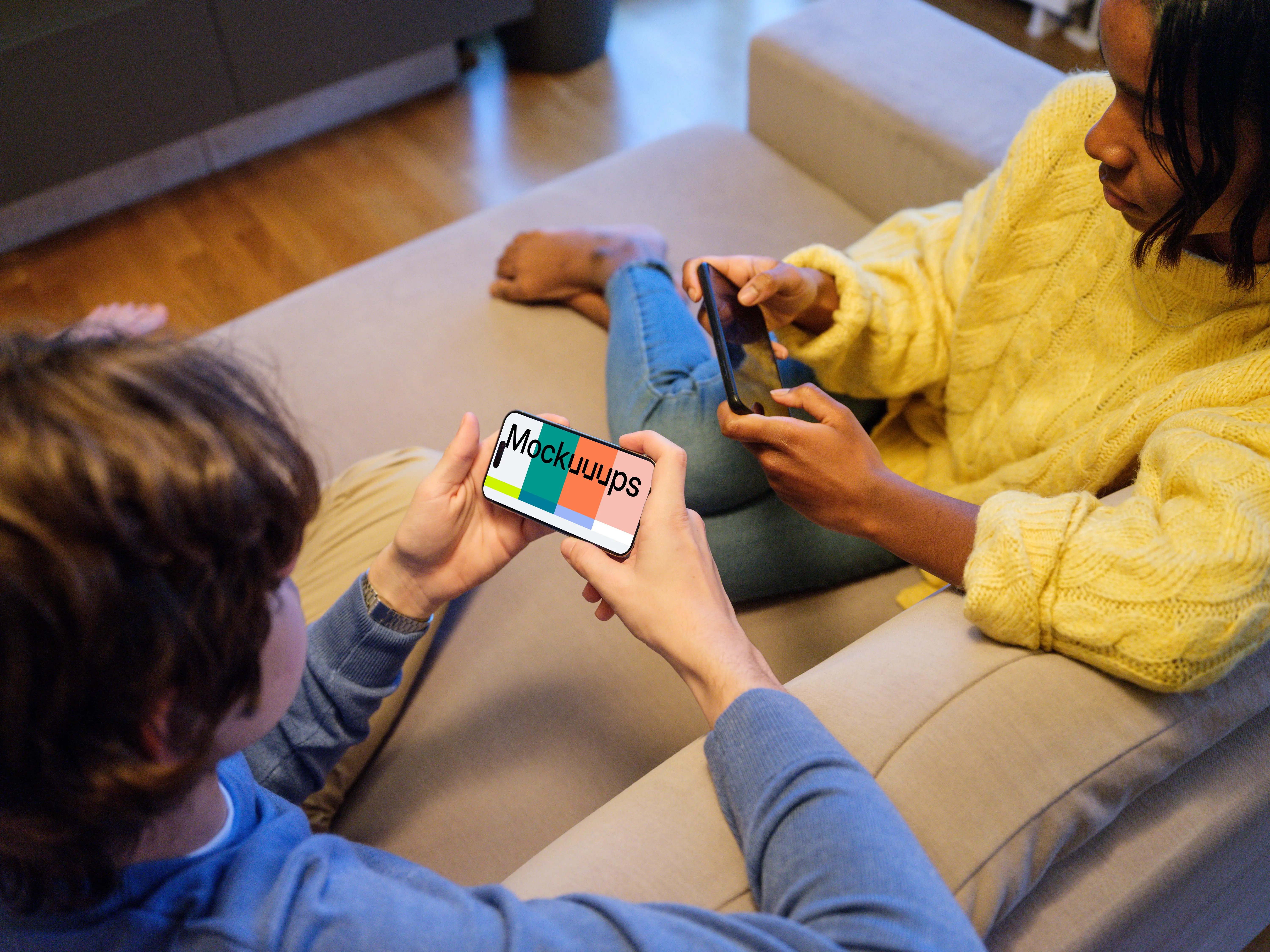 iPhone 15 Pro handheld mockup in a casual gaming setting