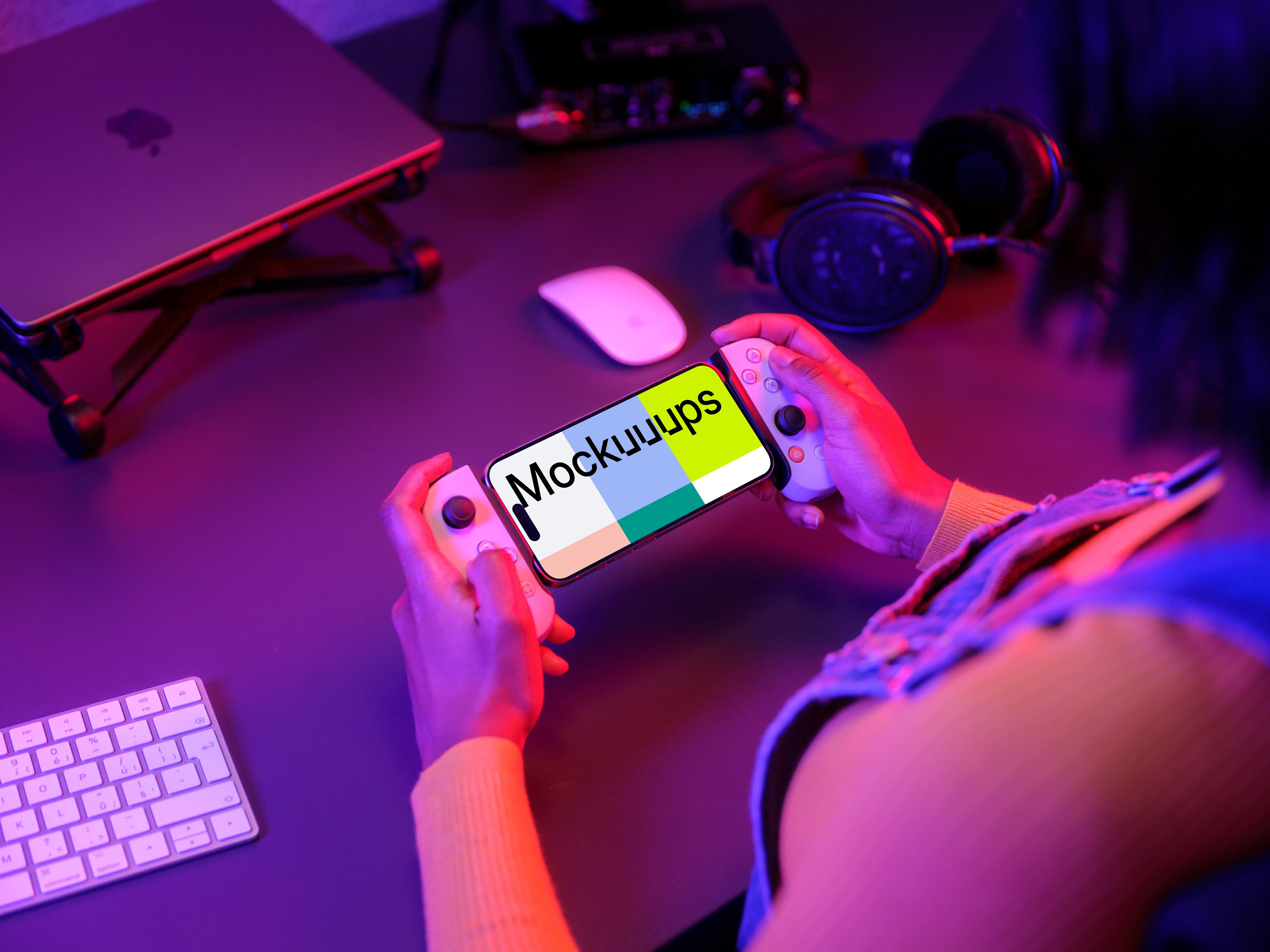 iPhone 15 Pro mockup in a gamer's hand with neon lighting