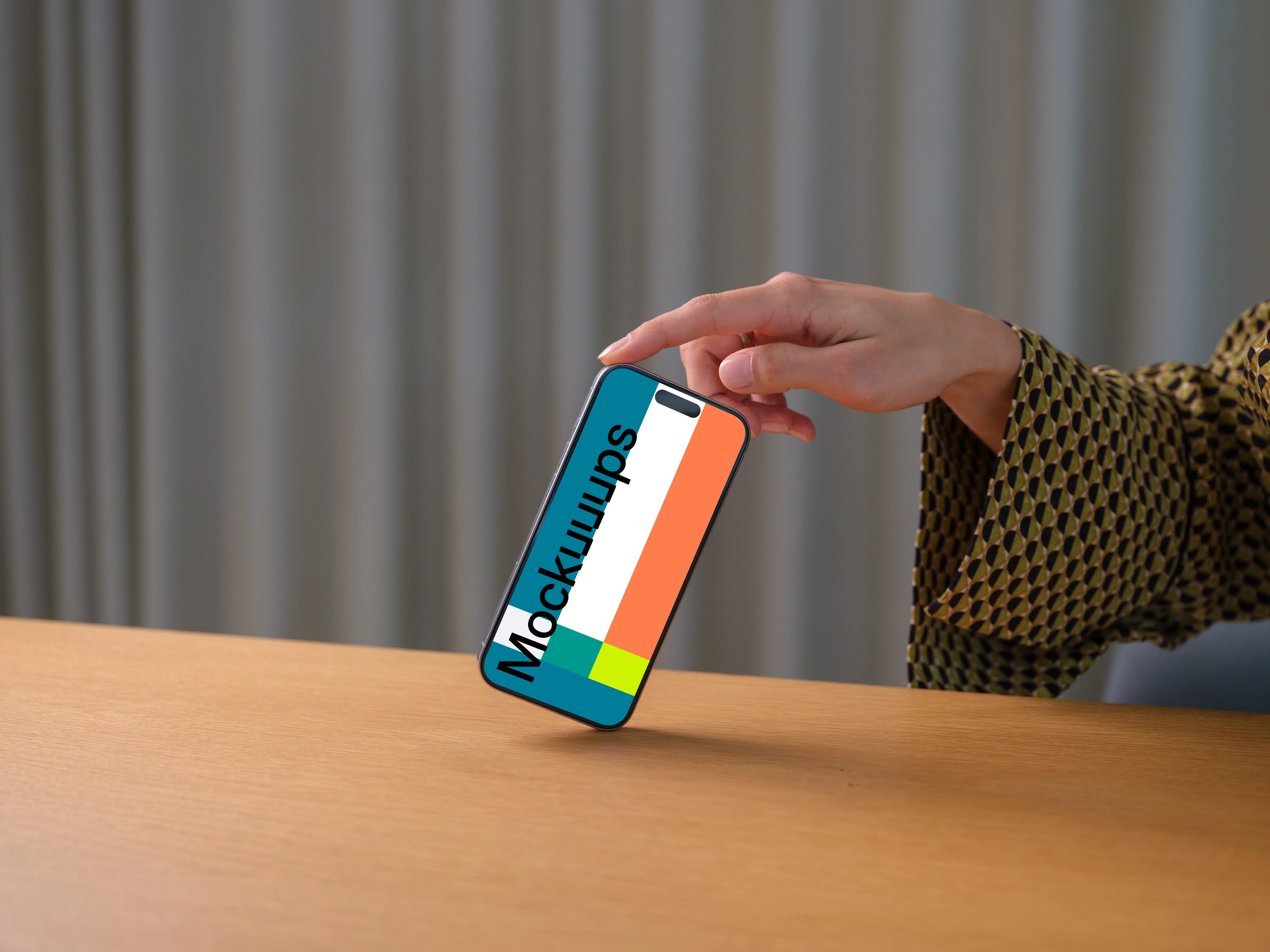 iPhone 15 Pro mockup in a woman's hand against office background