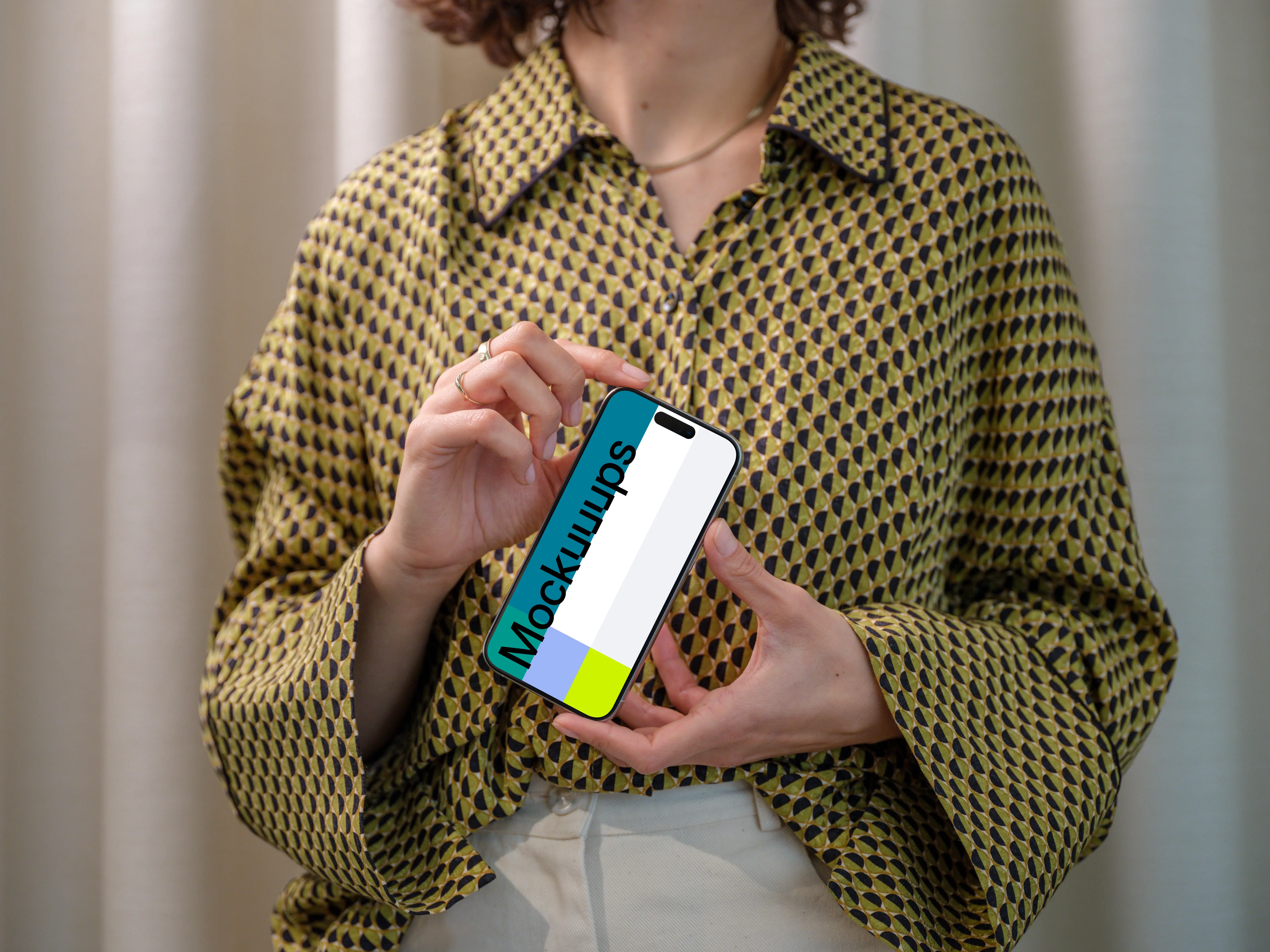 iPhone 15 Pro mockup in a woman's hand with stylish background