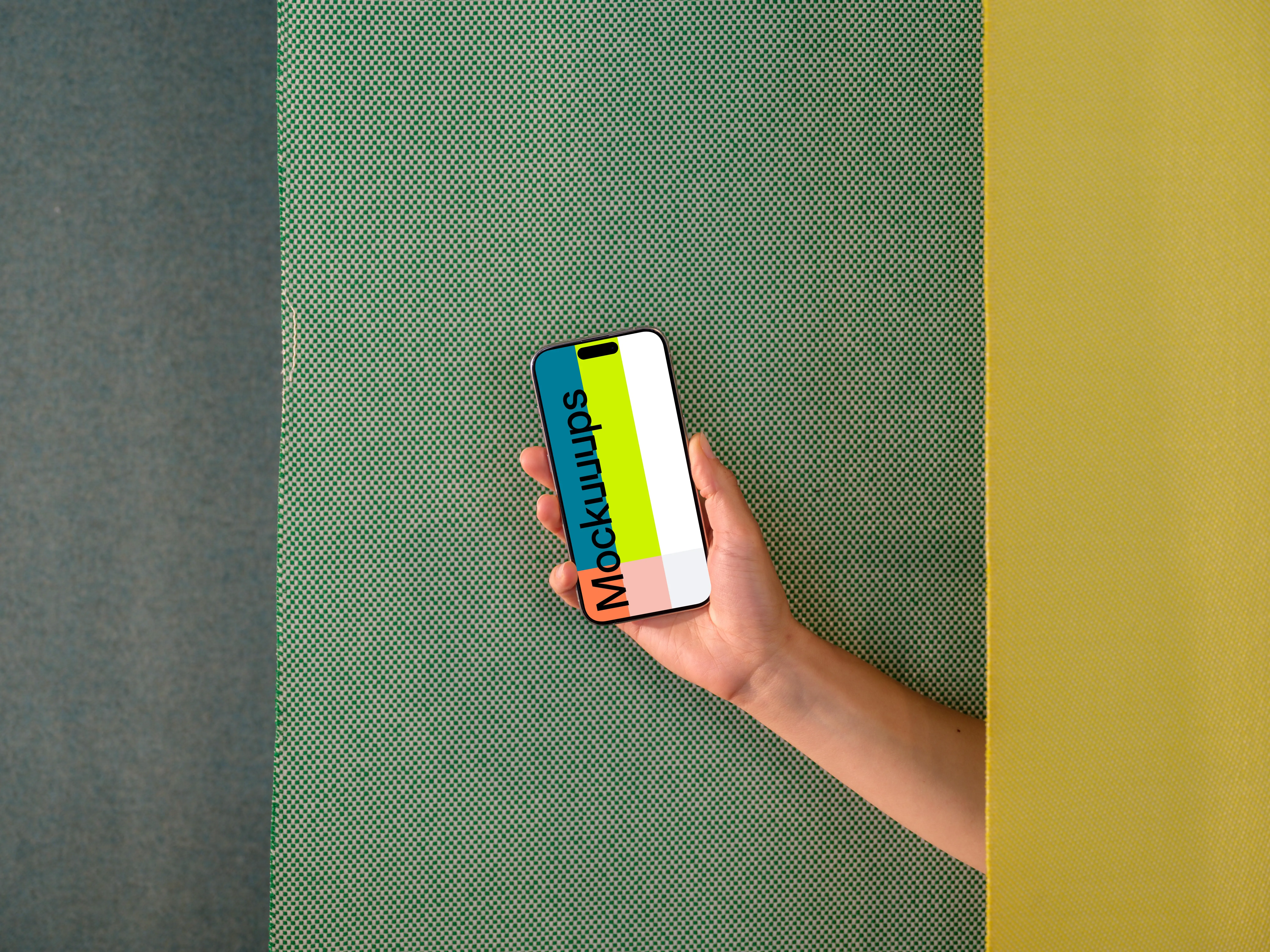 iPhone 15 Pro mockup in hand against dual-tone background