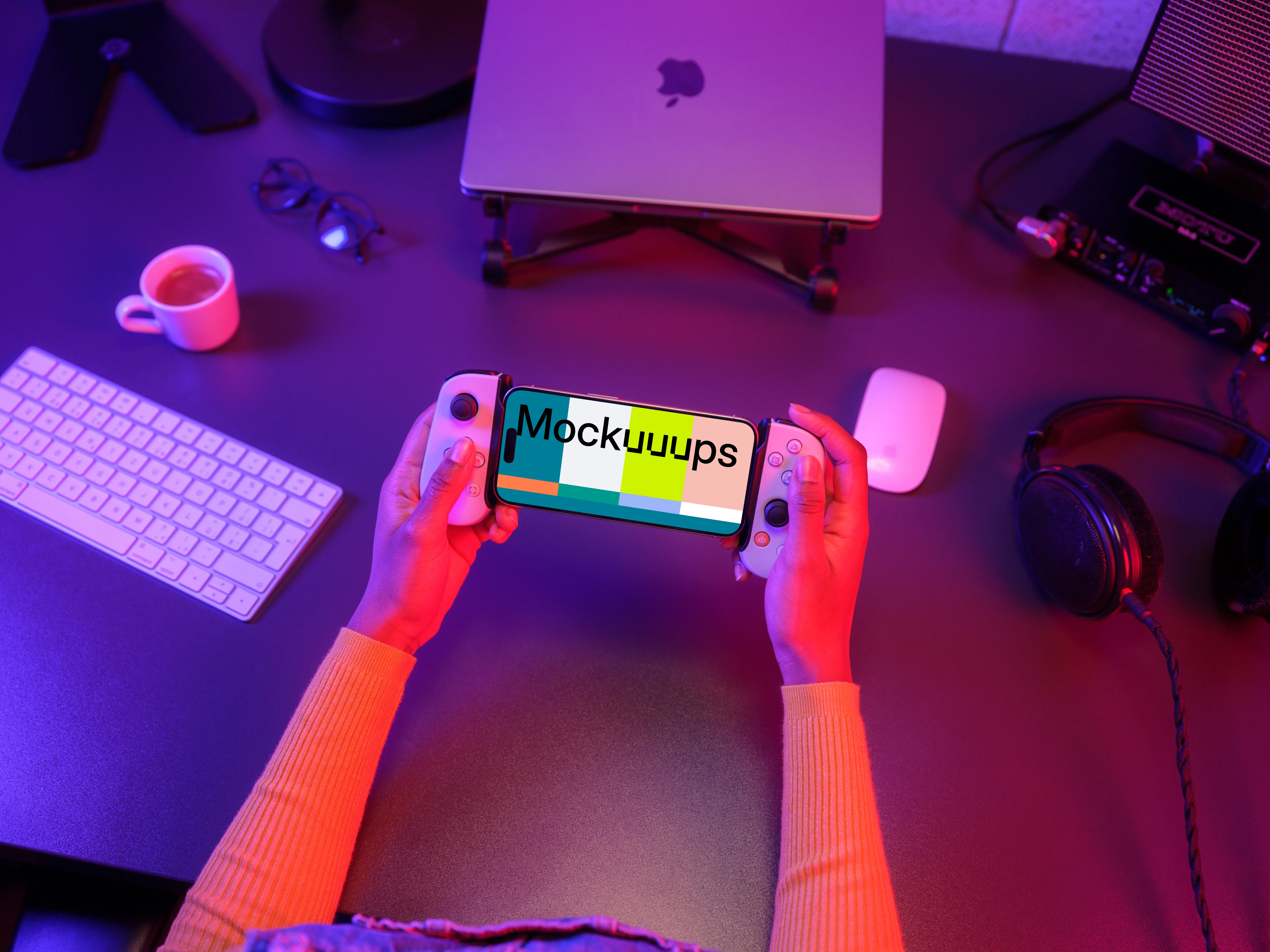 iPhone 15 Pro mockup in hand with gaming setup