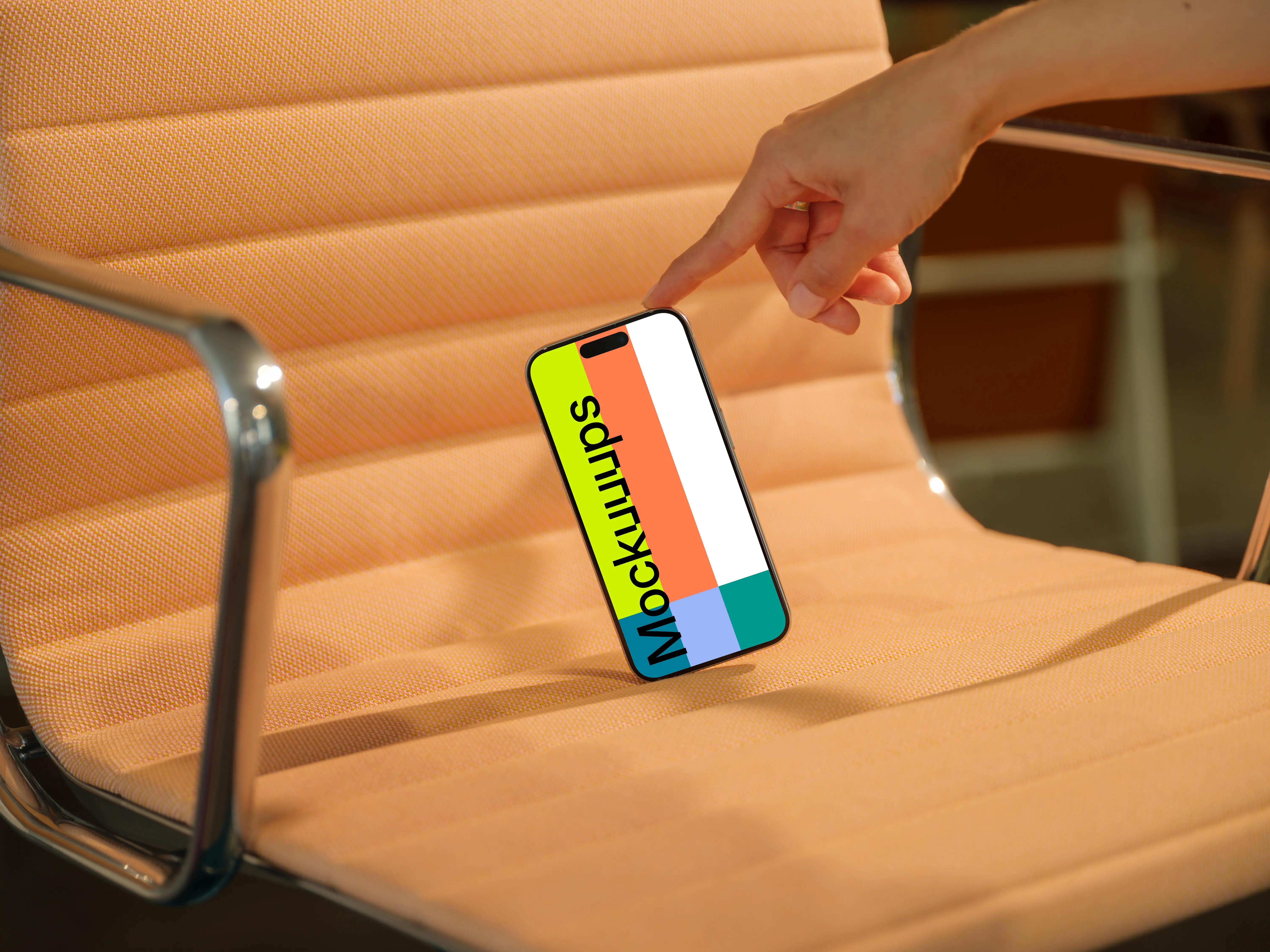 iPhone 15 Pro mockup on modern peach chair