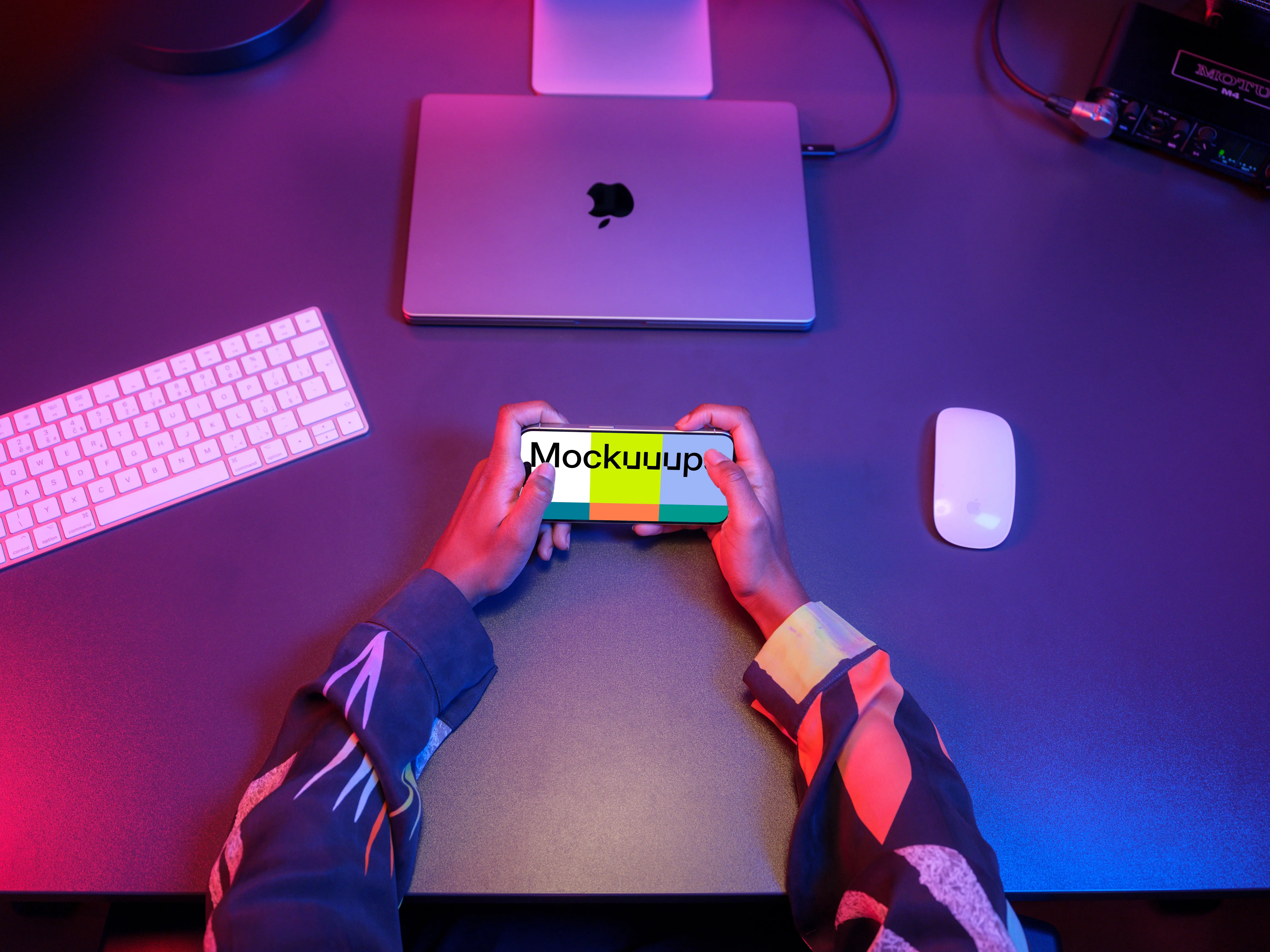 iPhone 15 Pro mockup surrounded by gaming setup