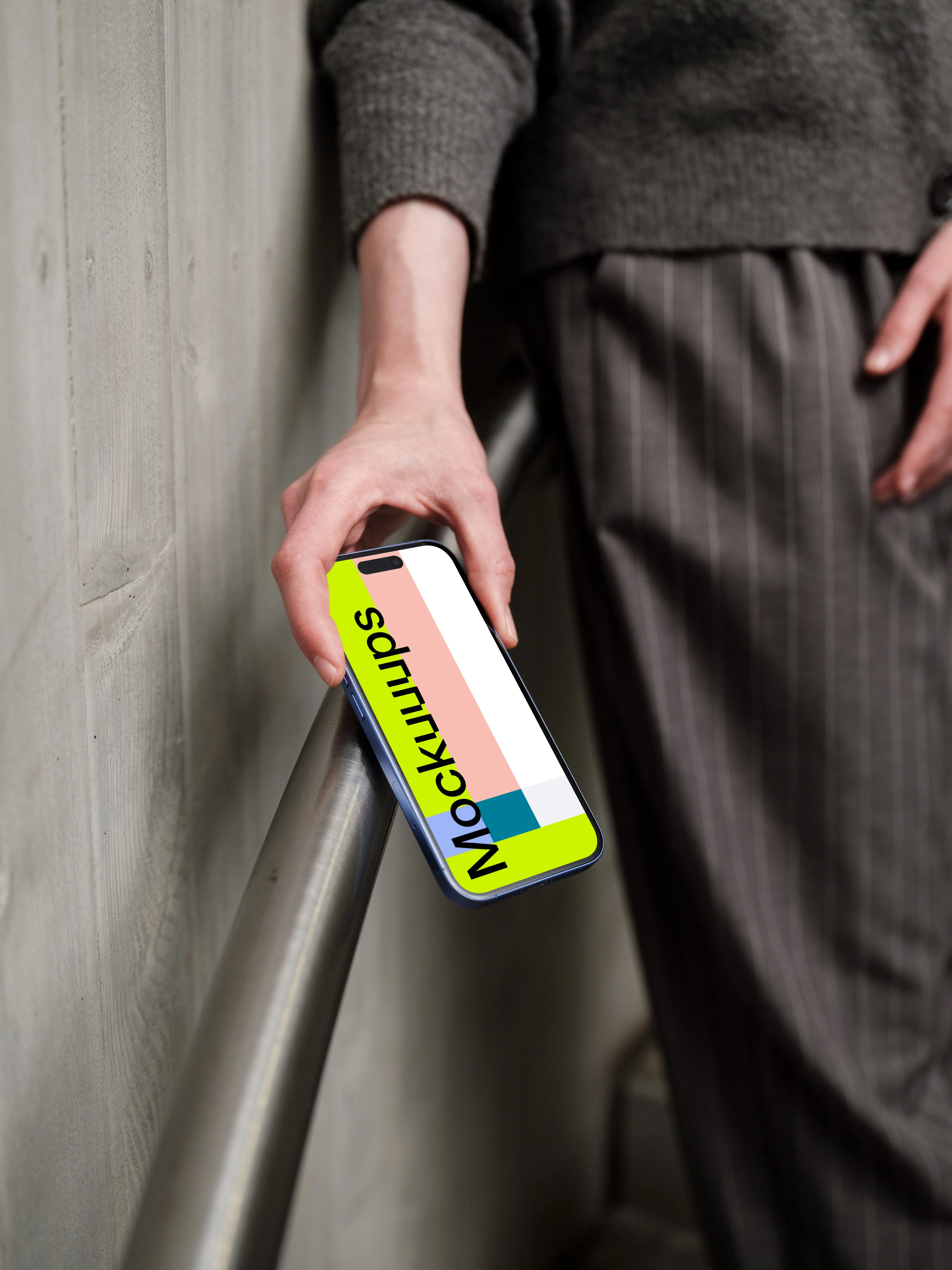 iPhone 16 mockup against concrete background