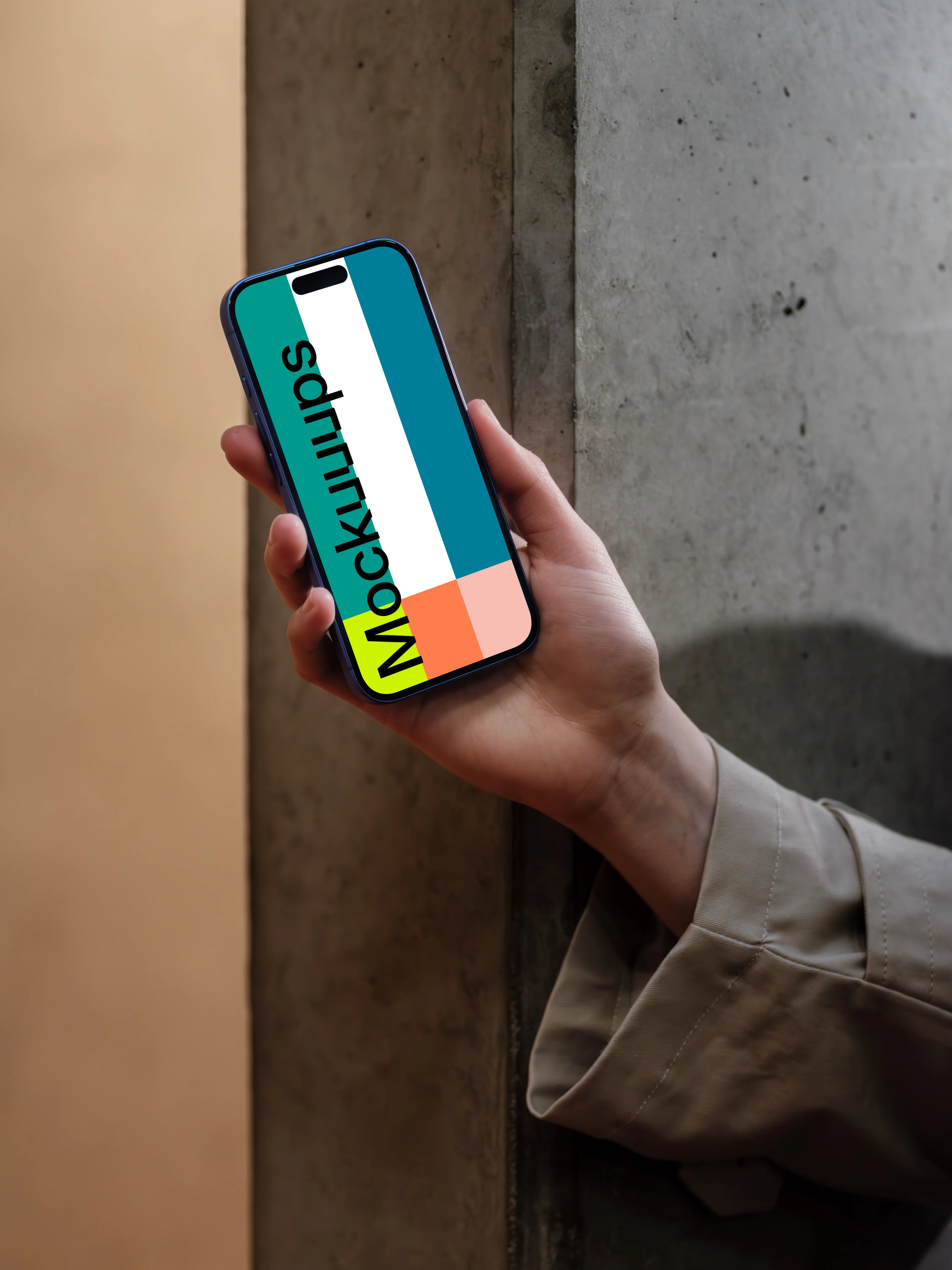 iPhone 16 mockup held against a concrete wall