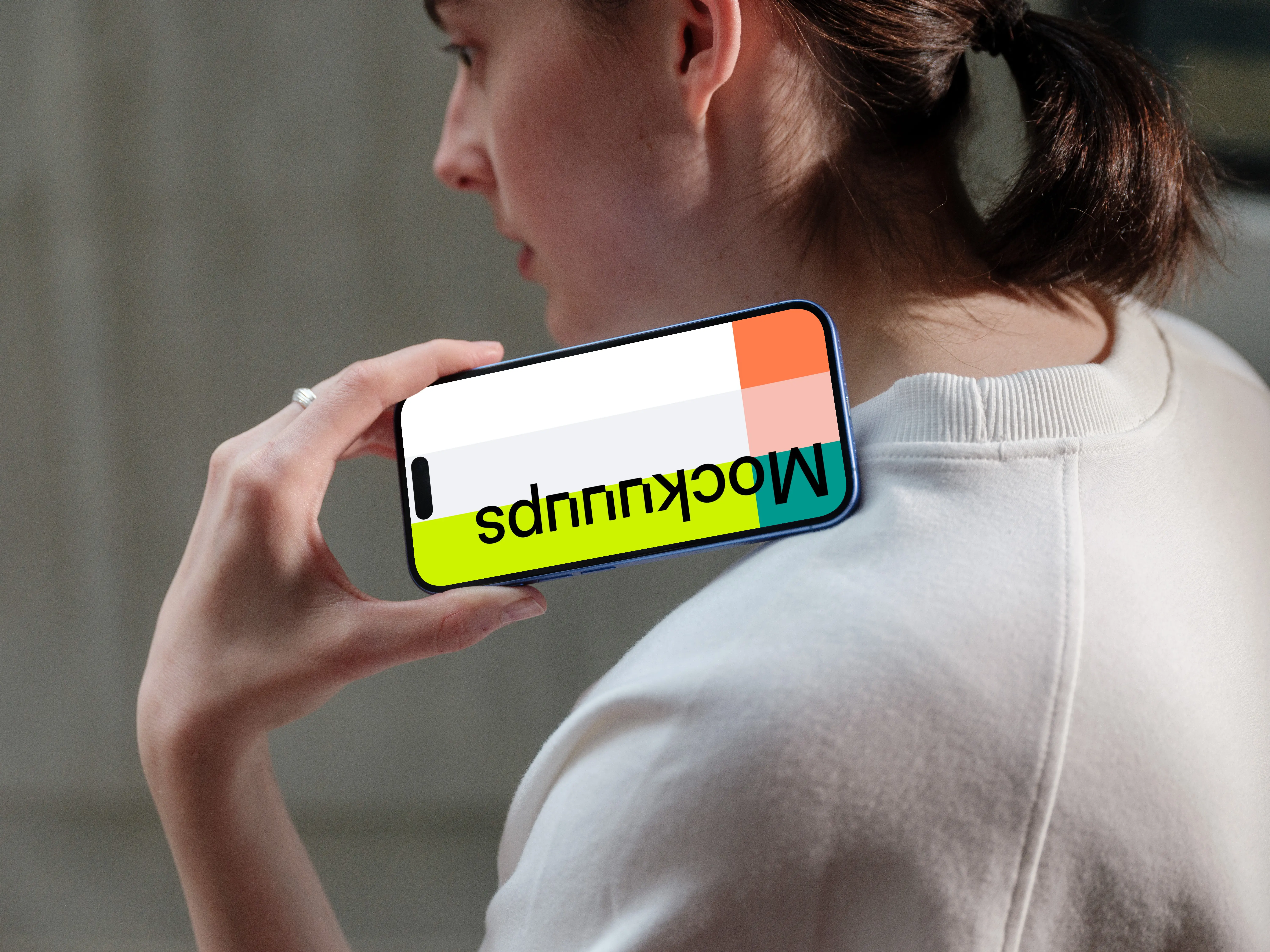 iPhone 16 mockup held in hand