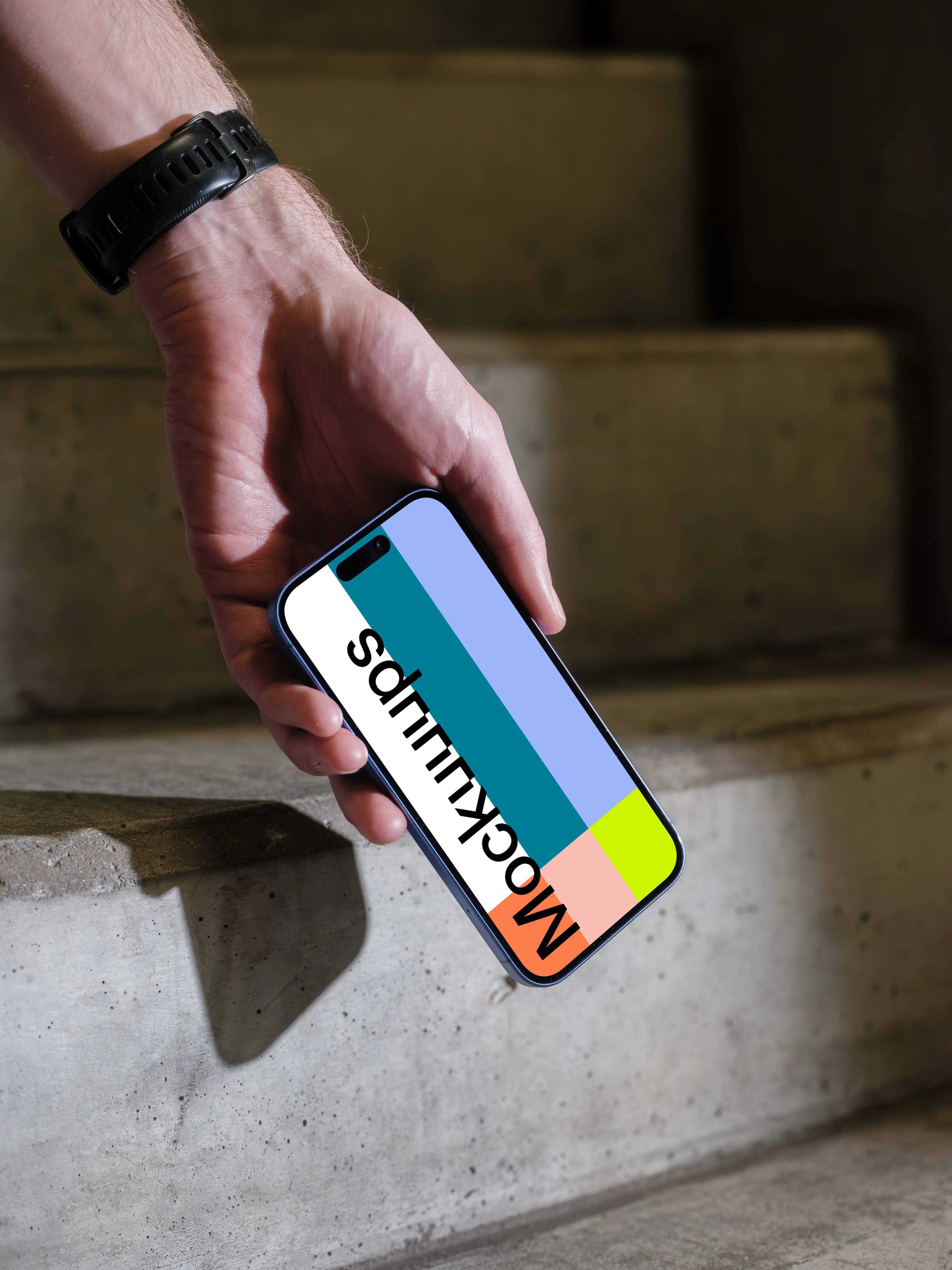 iPhone 16 mockup on concrete stairs