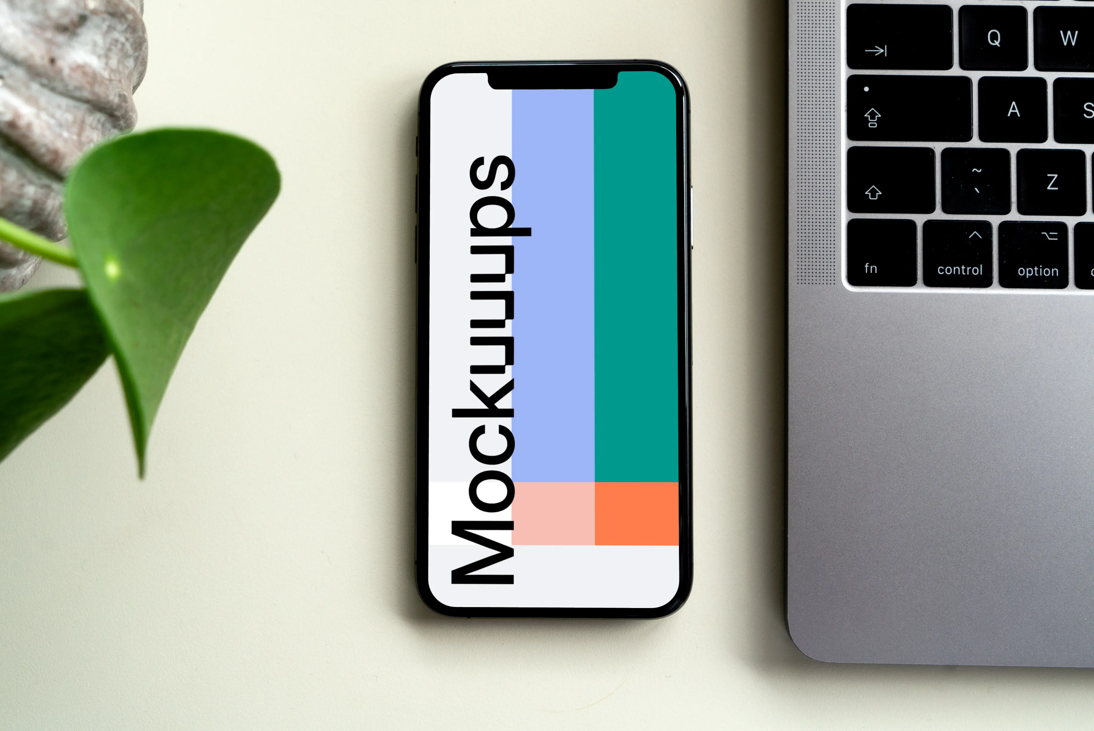 iPhone mockup beside a MacBook