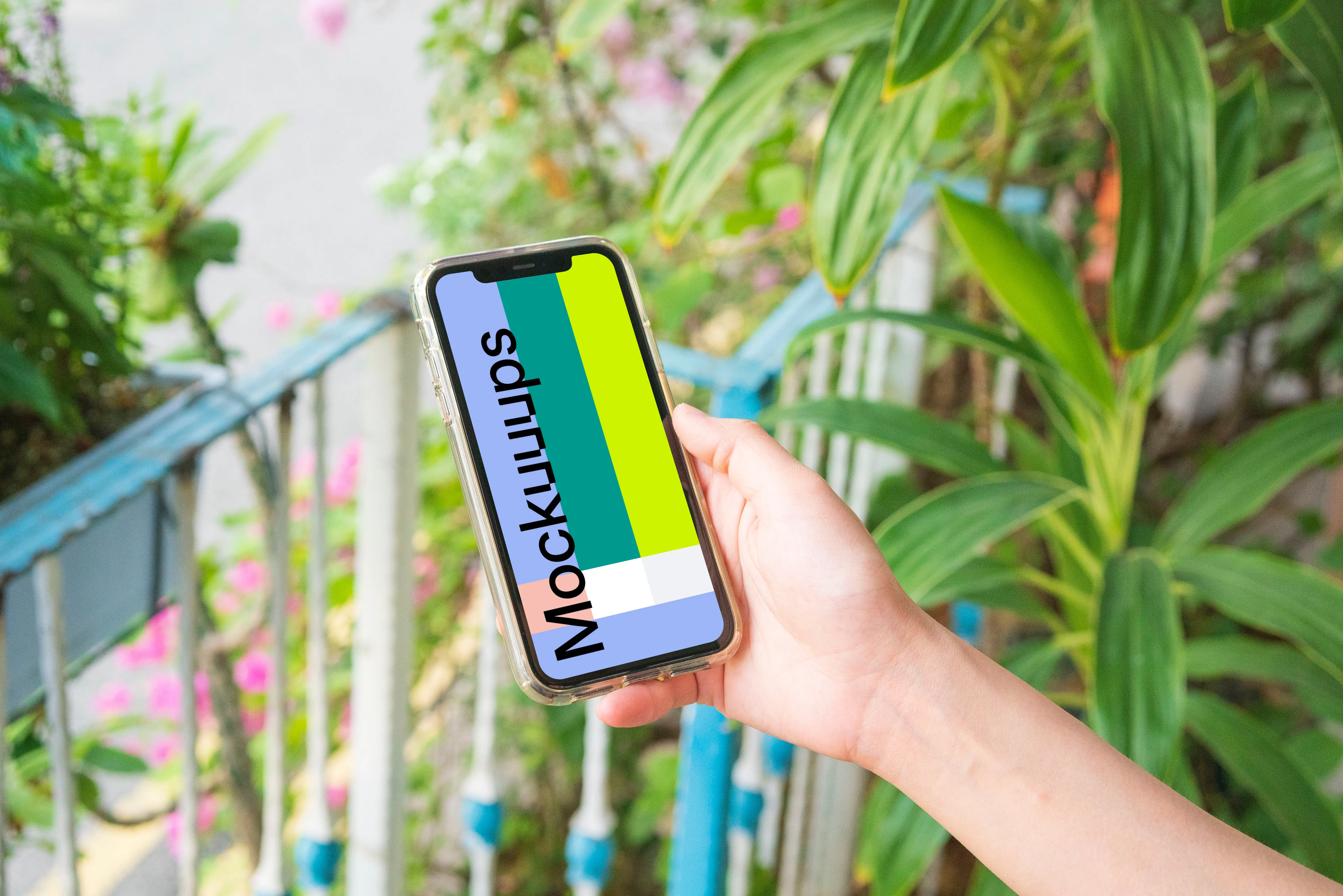 iPhone mockup held on a mockup