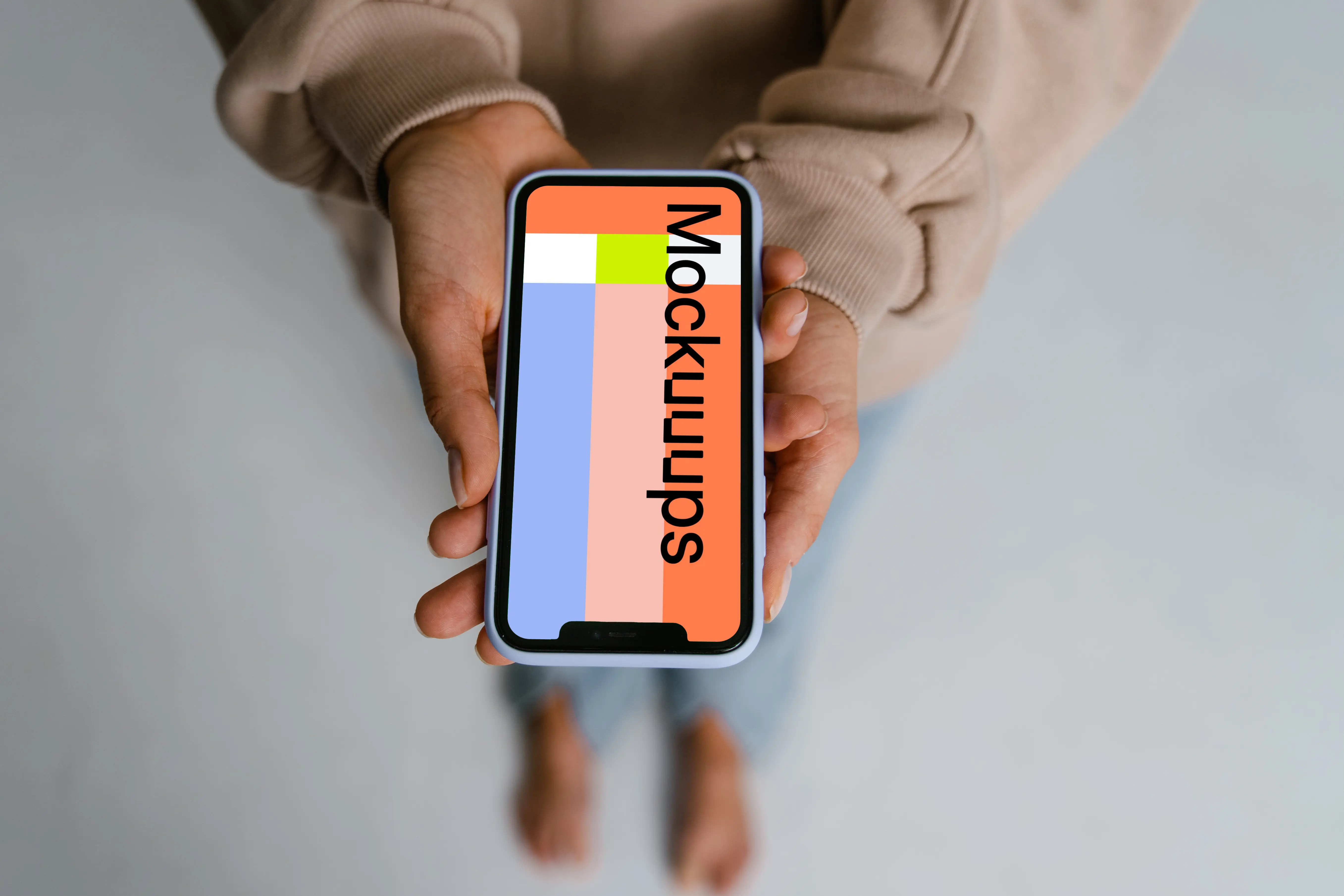 iPhone mockup held with two hands