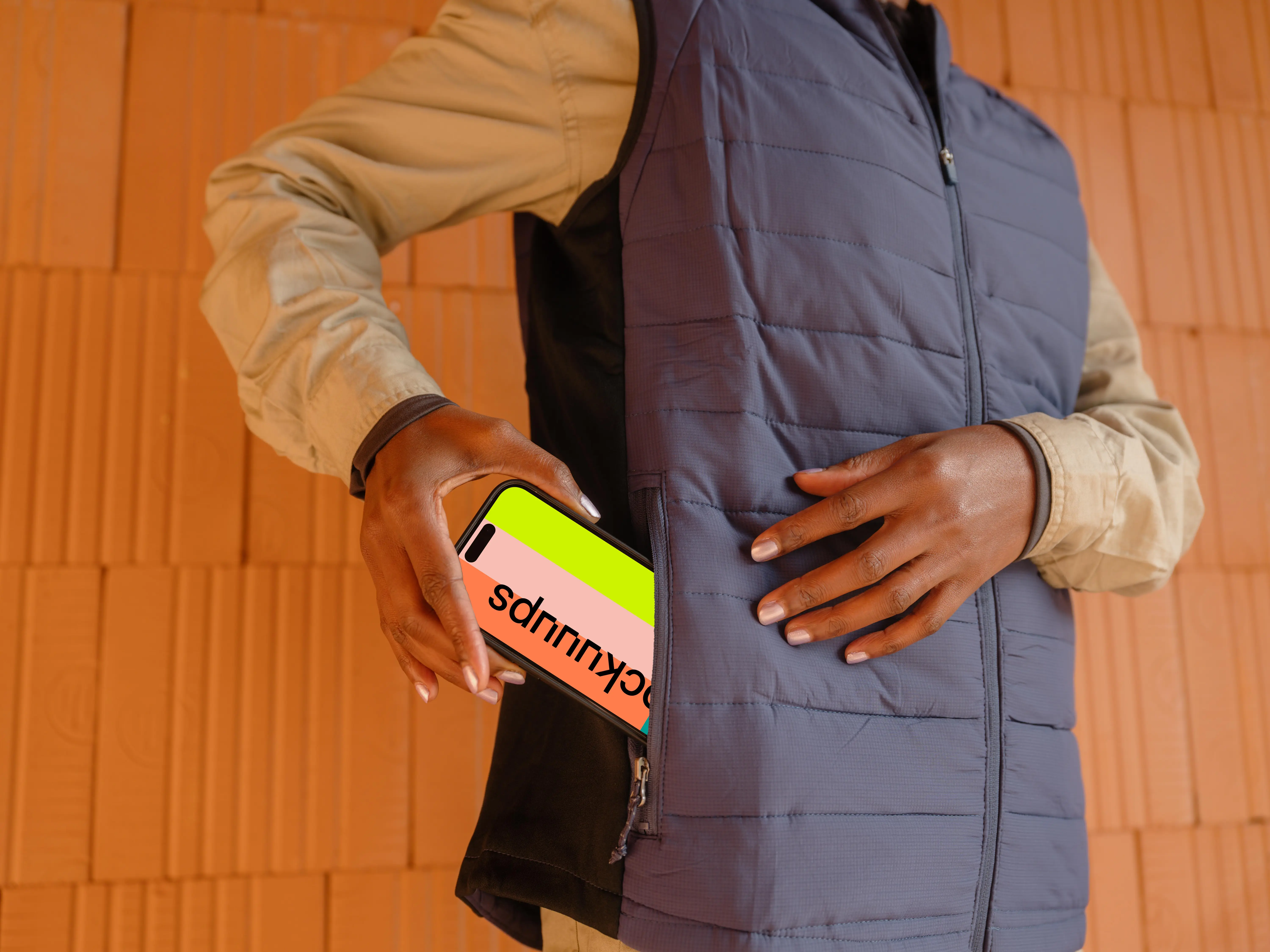 iPhone mockup in the pocket of female engineer