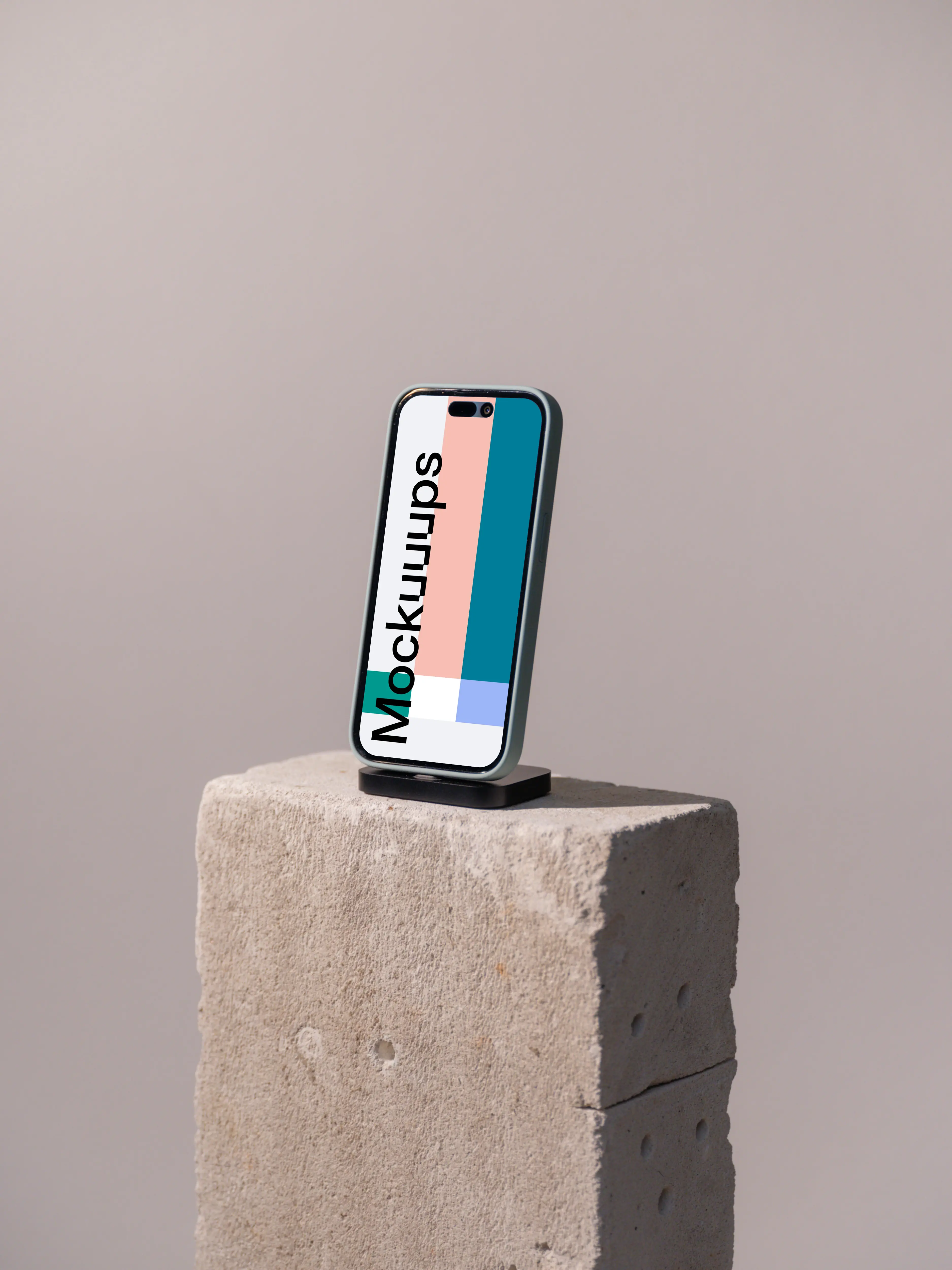 iPhone mockup on a concrete brick