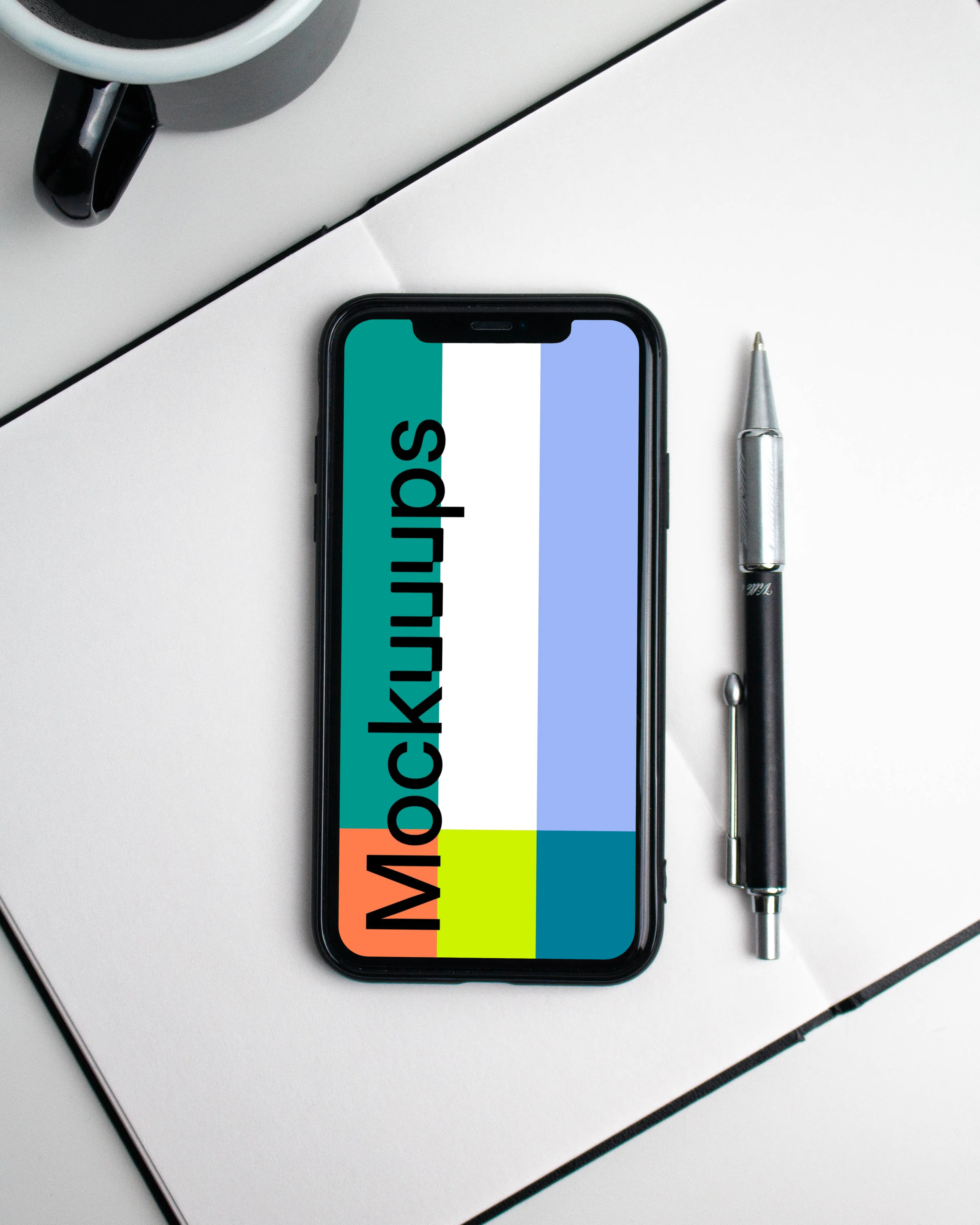 iPhone mockup on a white notebook