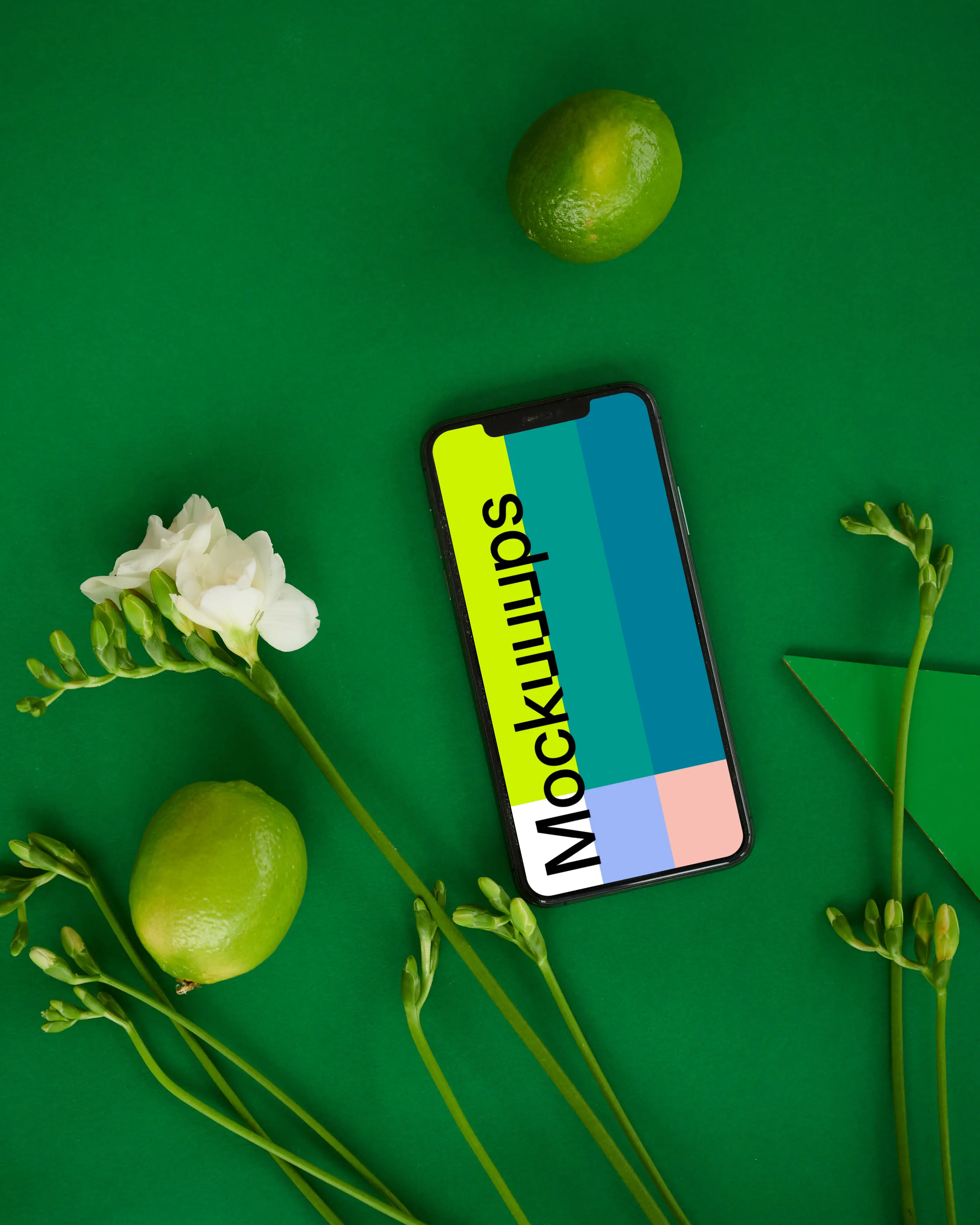 iPhone mockup on green table