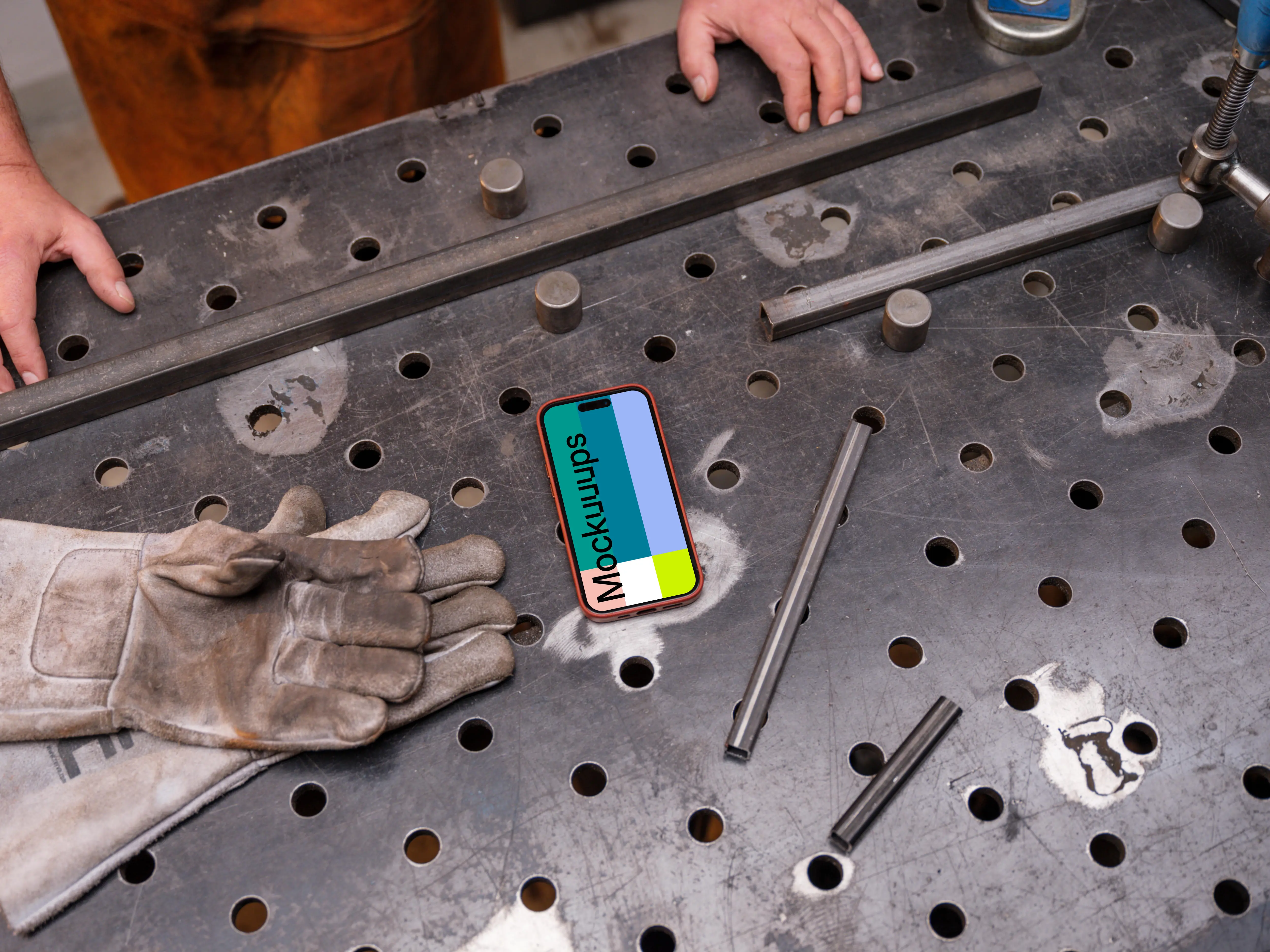 iPhone mockup placed on an iron table