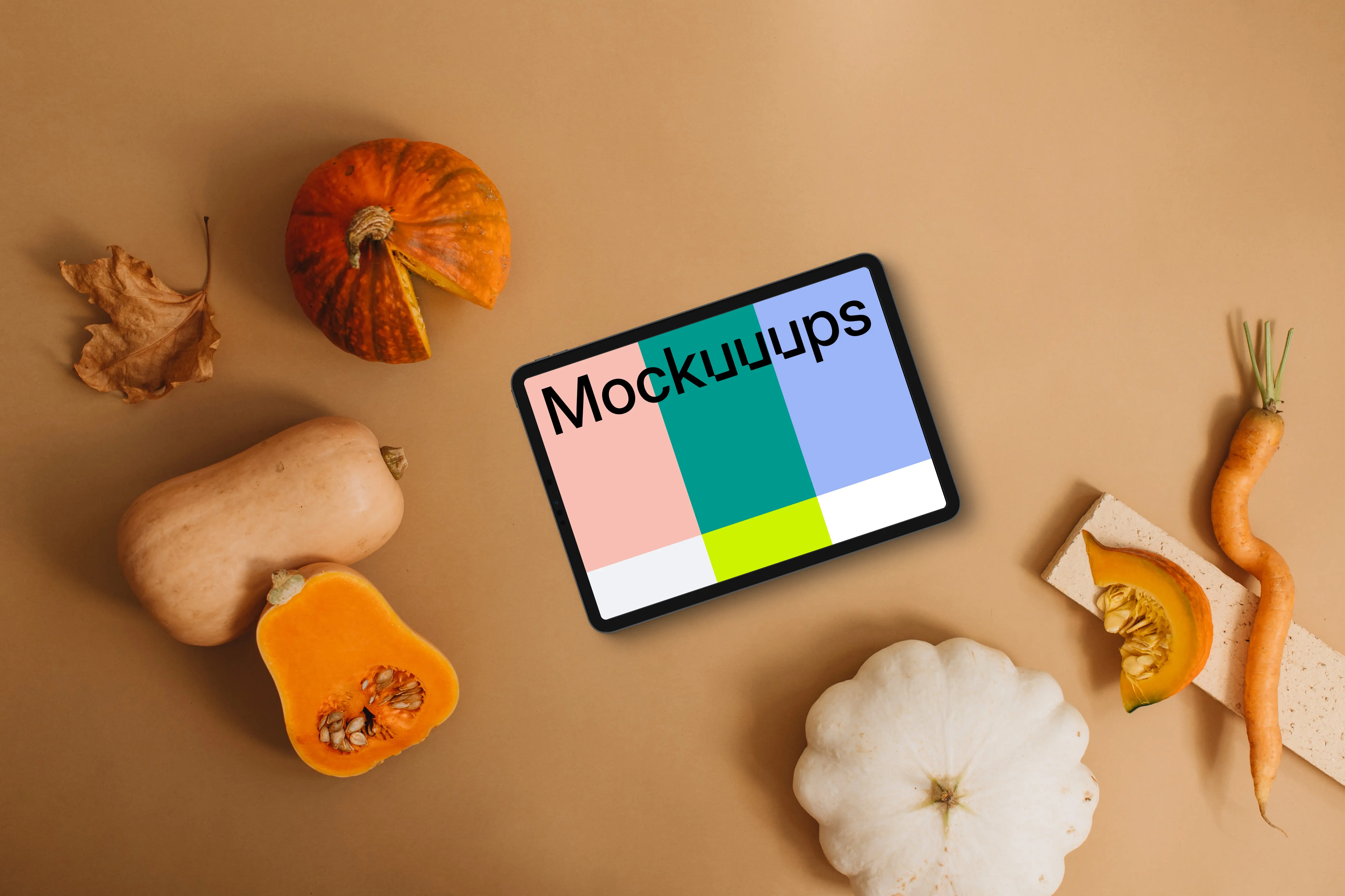 Landscape tablet mockup next to the pumpkin