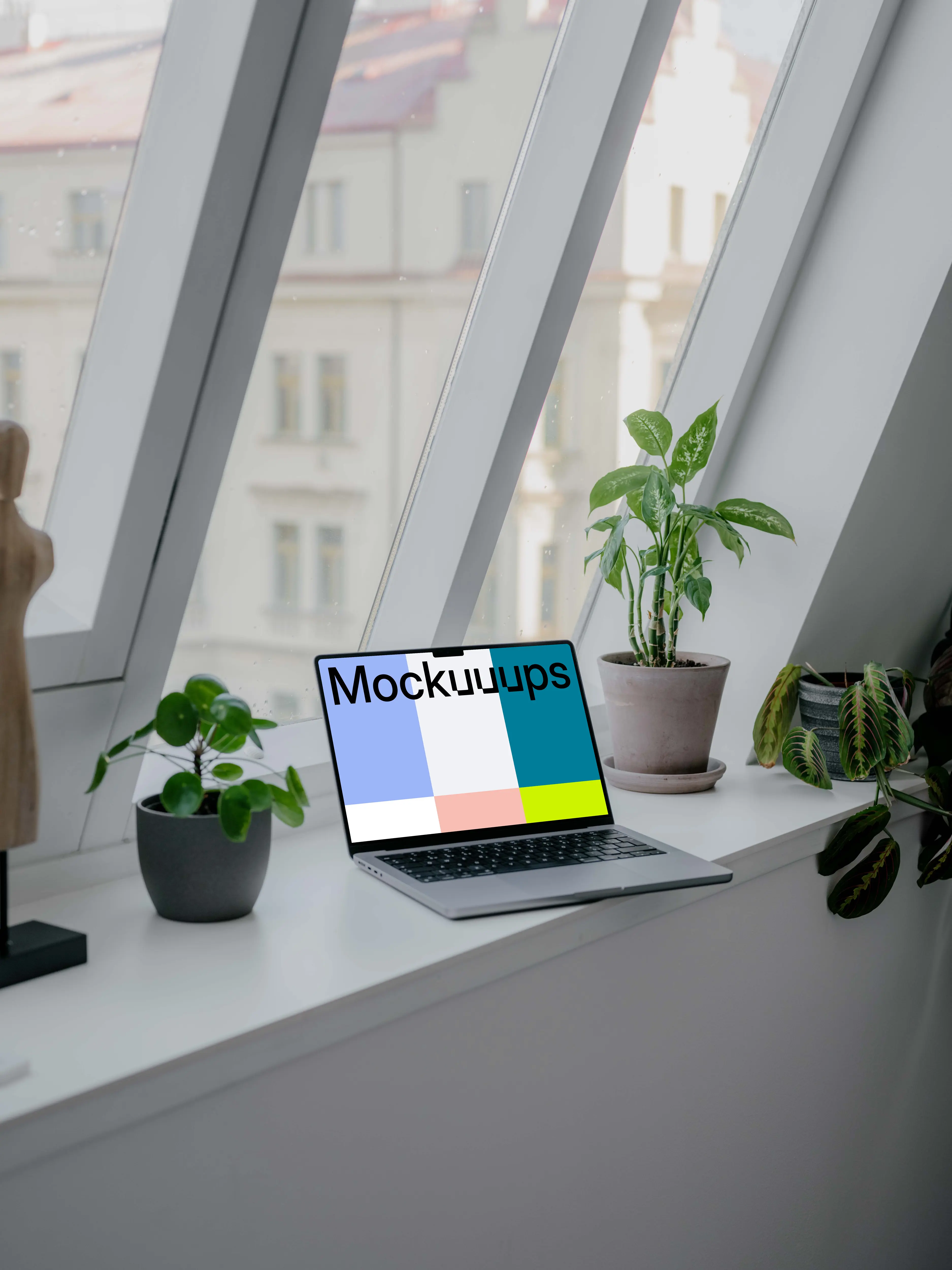 Laptop mockup next to the window