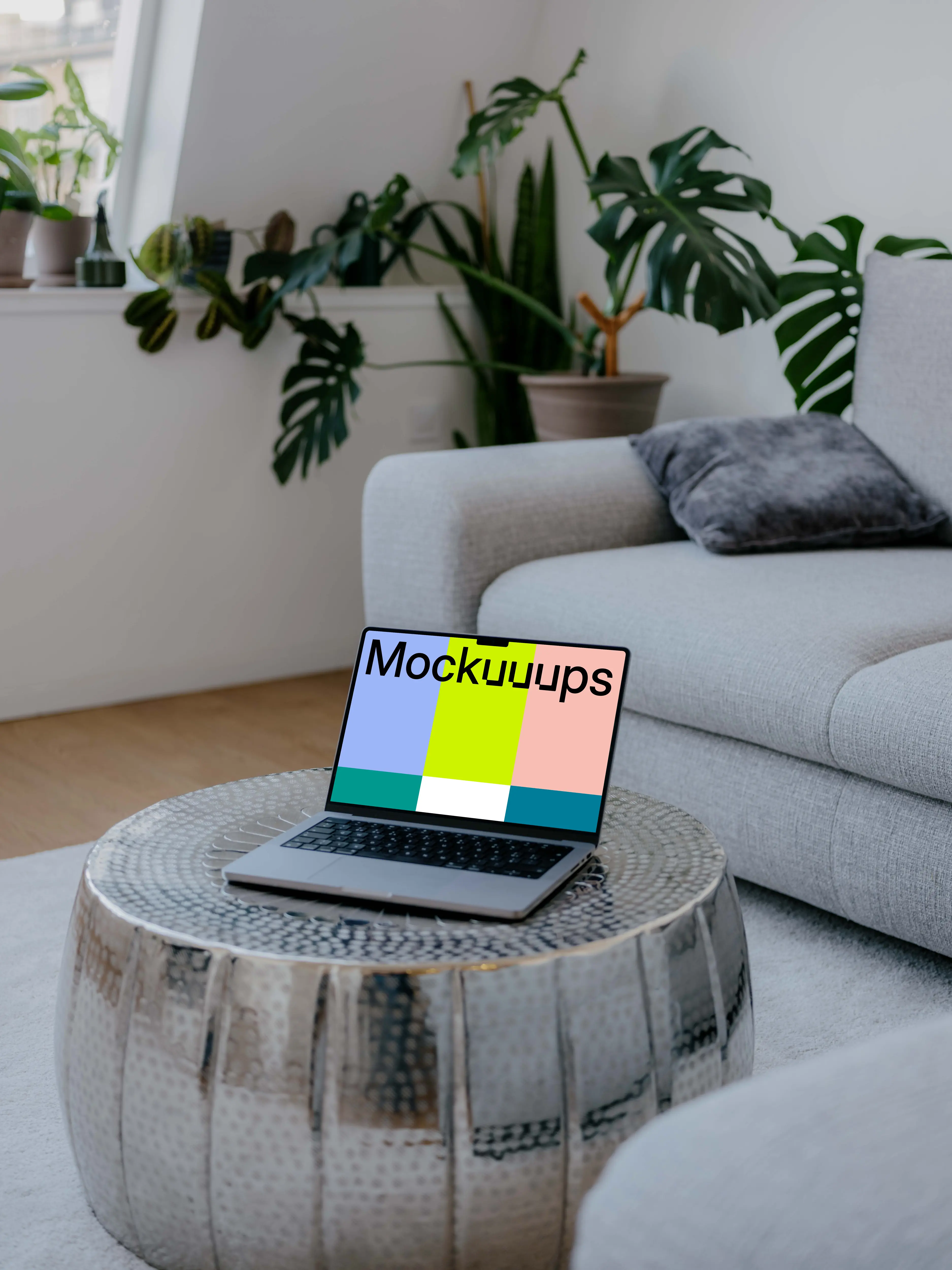 Laptop mockup on the silver table