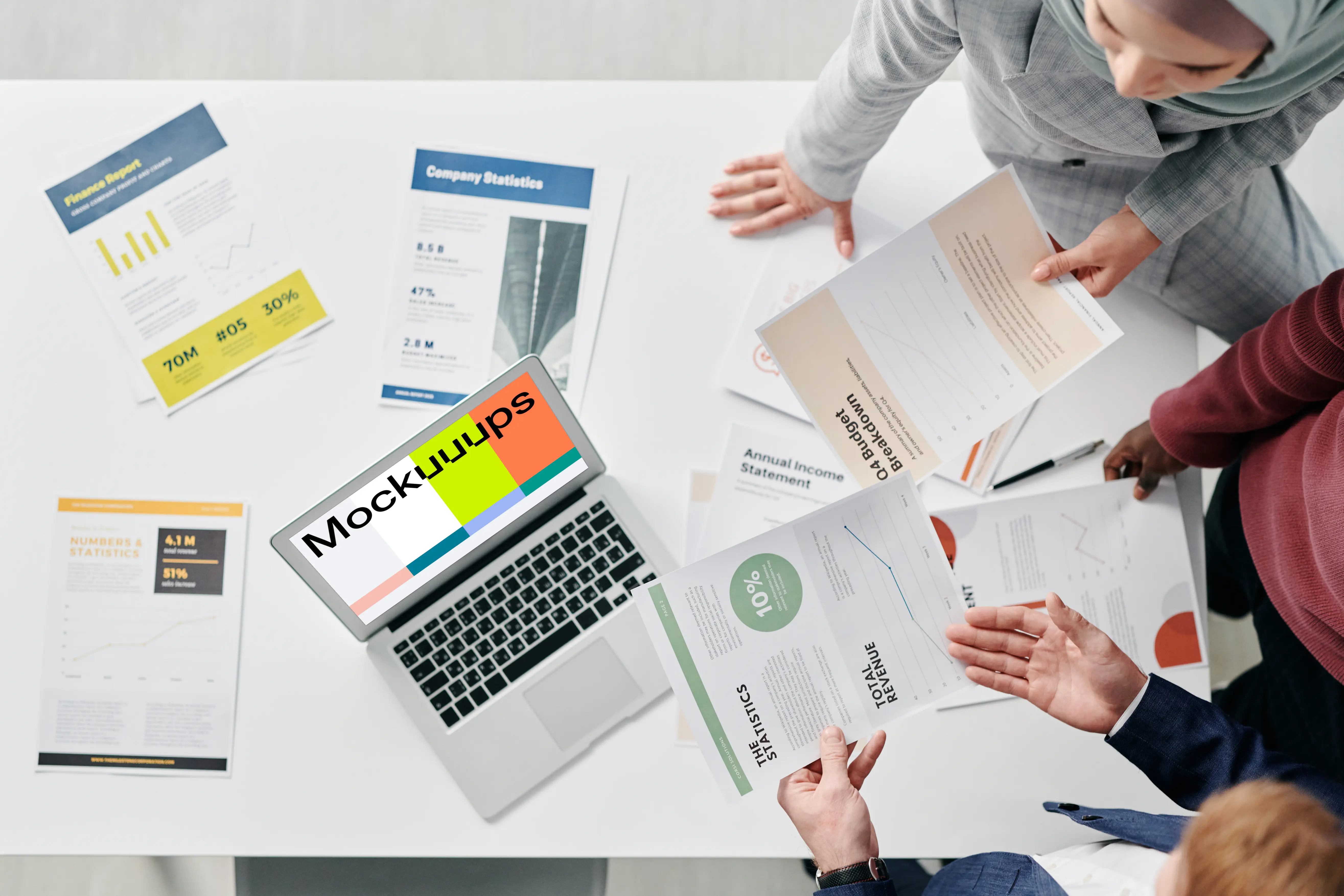 MacBook Air mockup on a table in a business meeting