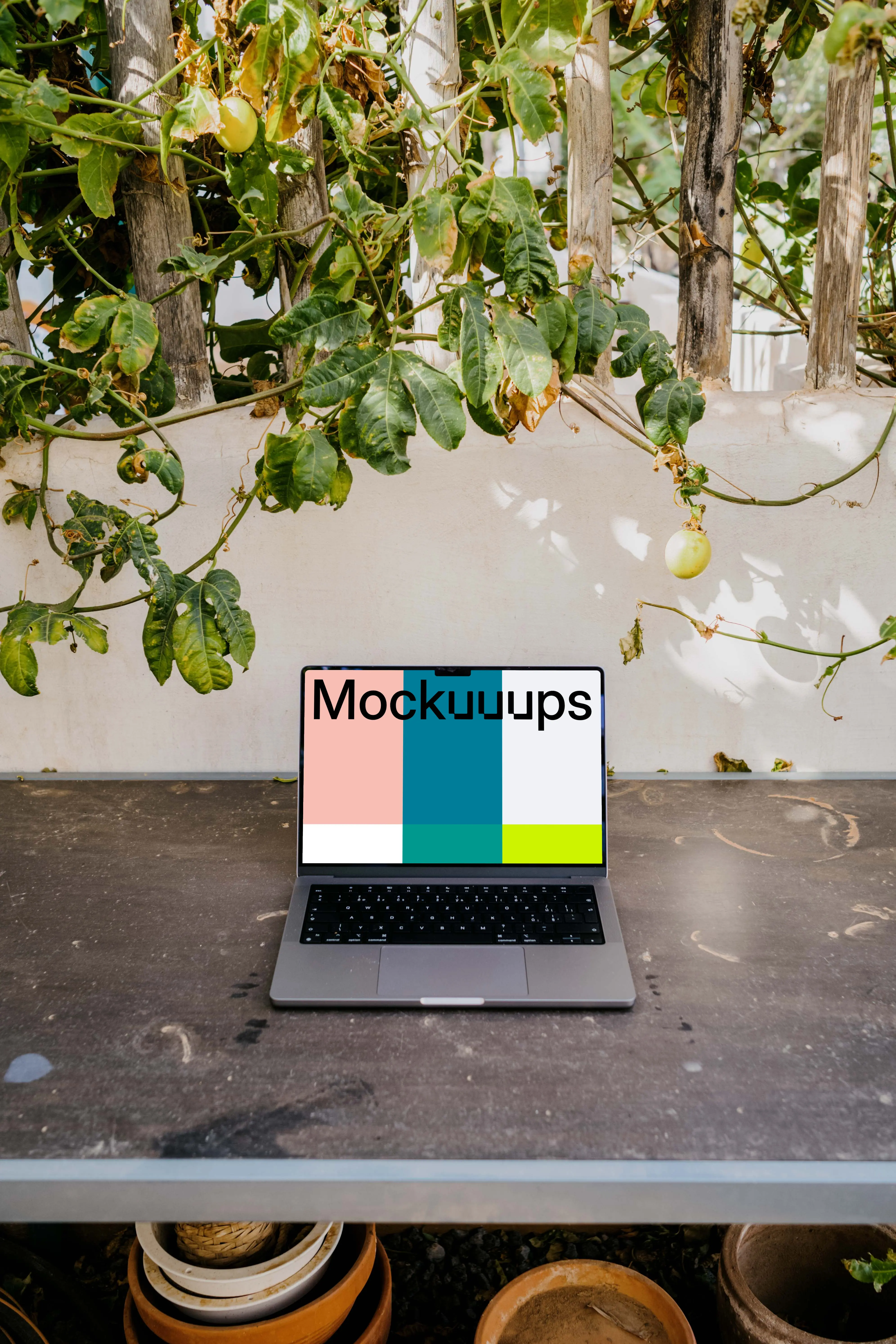 MacBook Pro mockup under a climbing plant