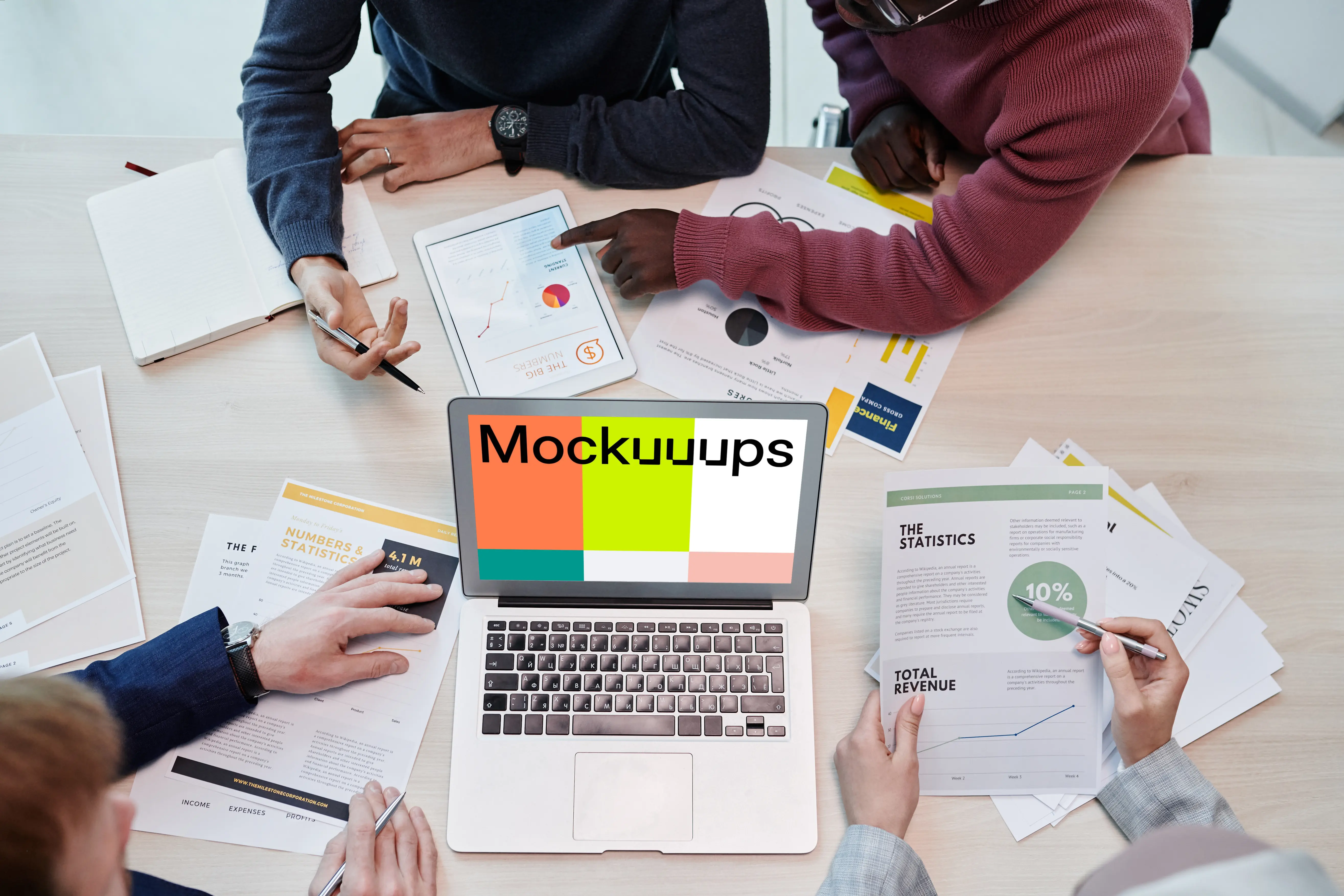 MacBook Air mokcup beside business documents