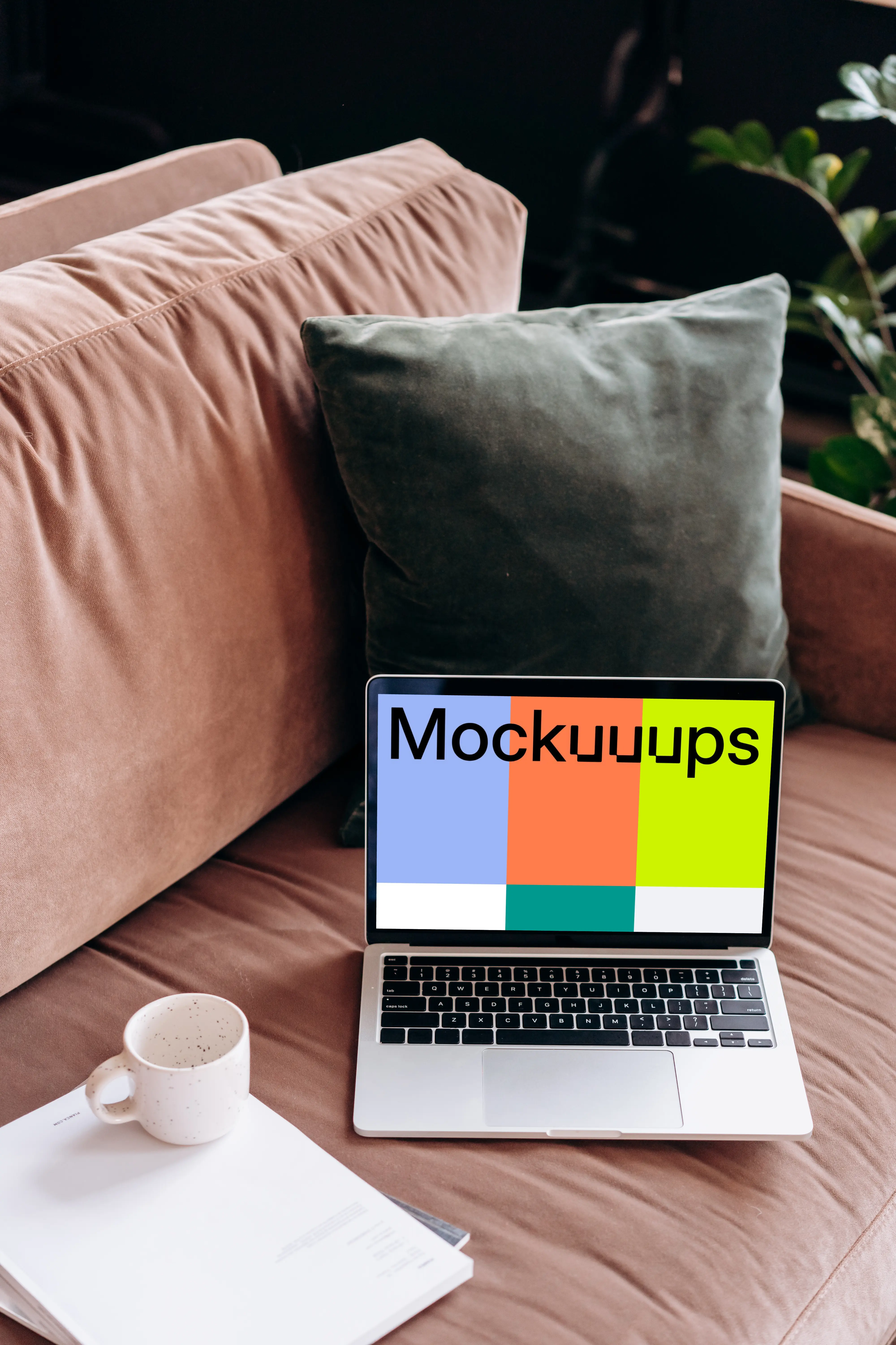 MacBook Pro mockup beside a coffee mug