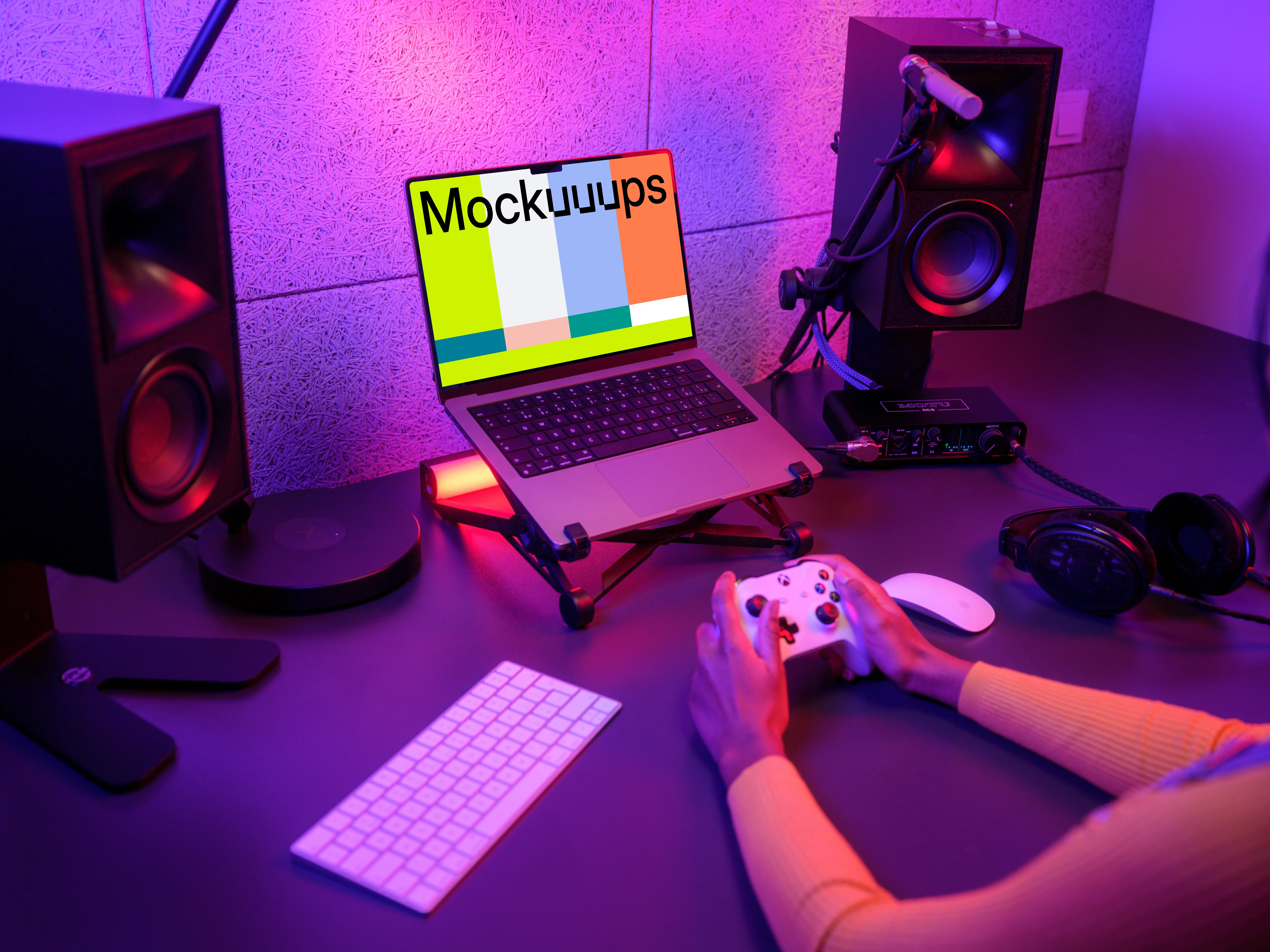MacBook Pro mockup in a neon-lit gaming setup