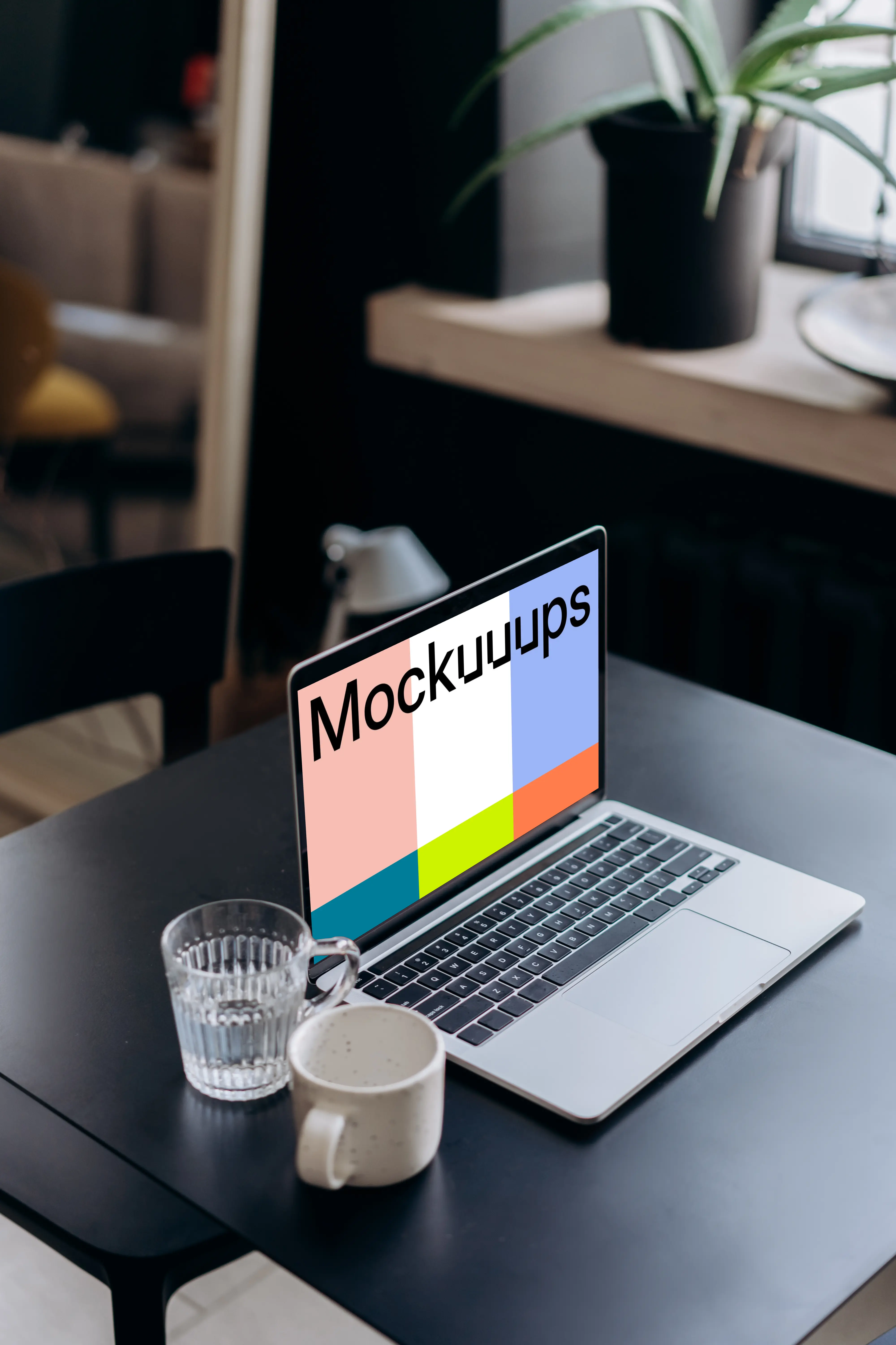 MacBook Pro mockup on a black table