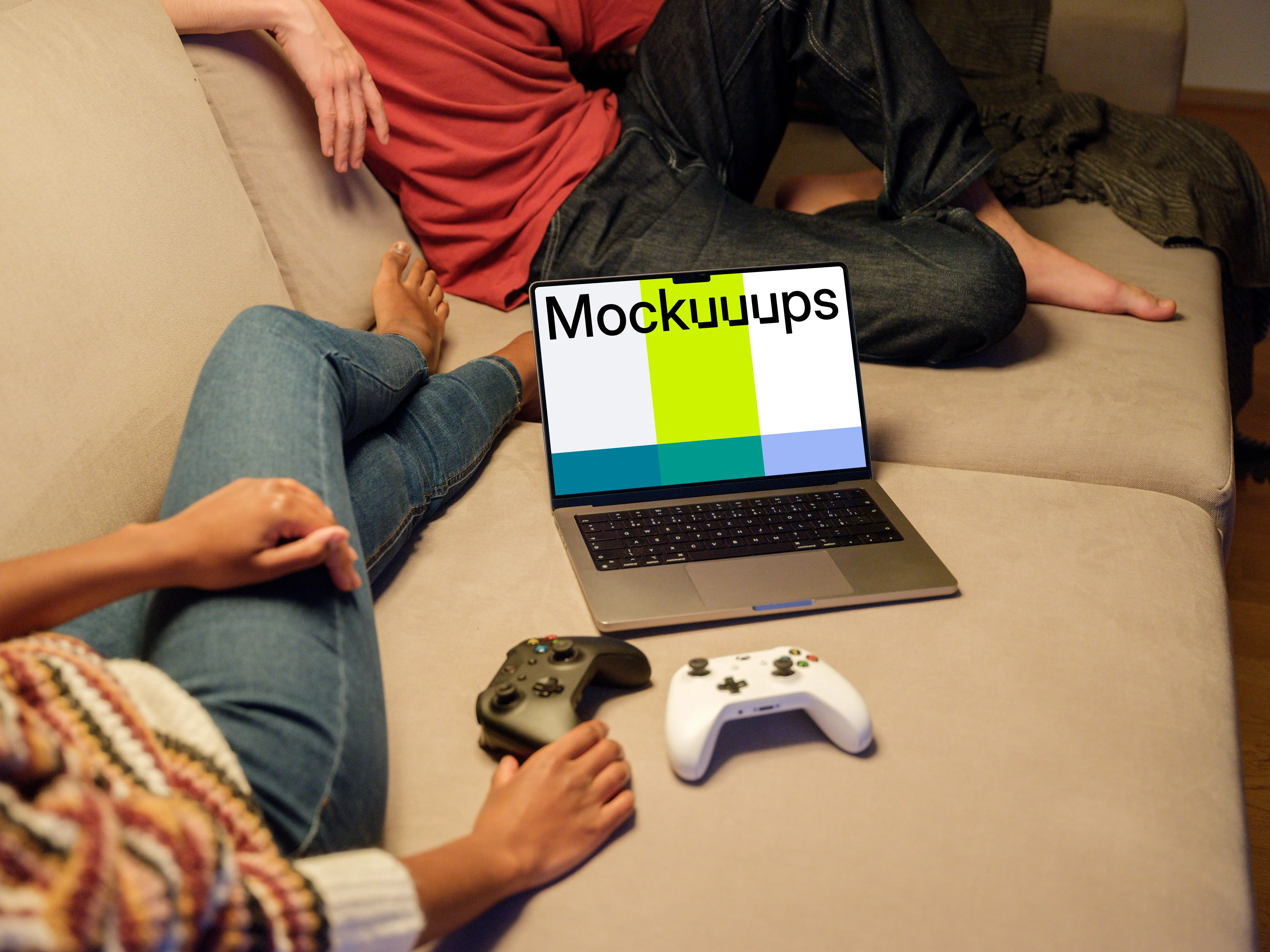 MacBook Pro Mockup on a Cozy Sofa with Game Controllers