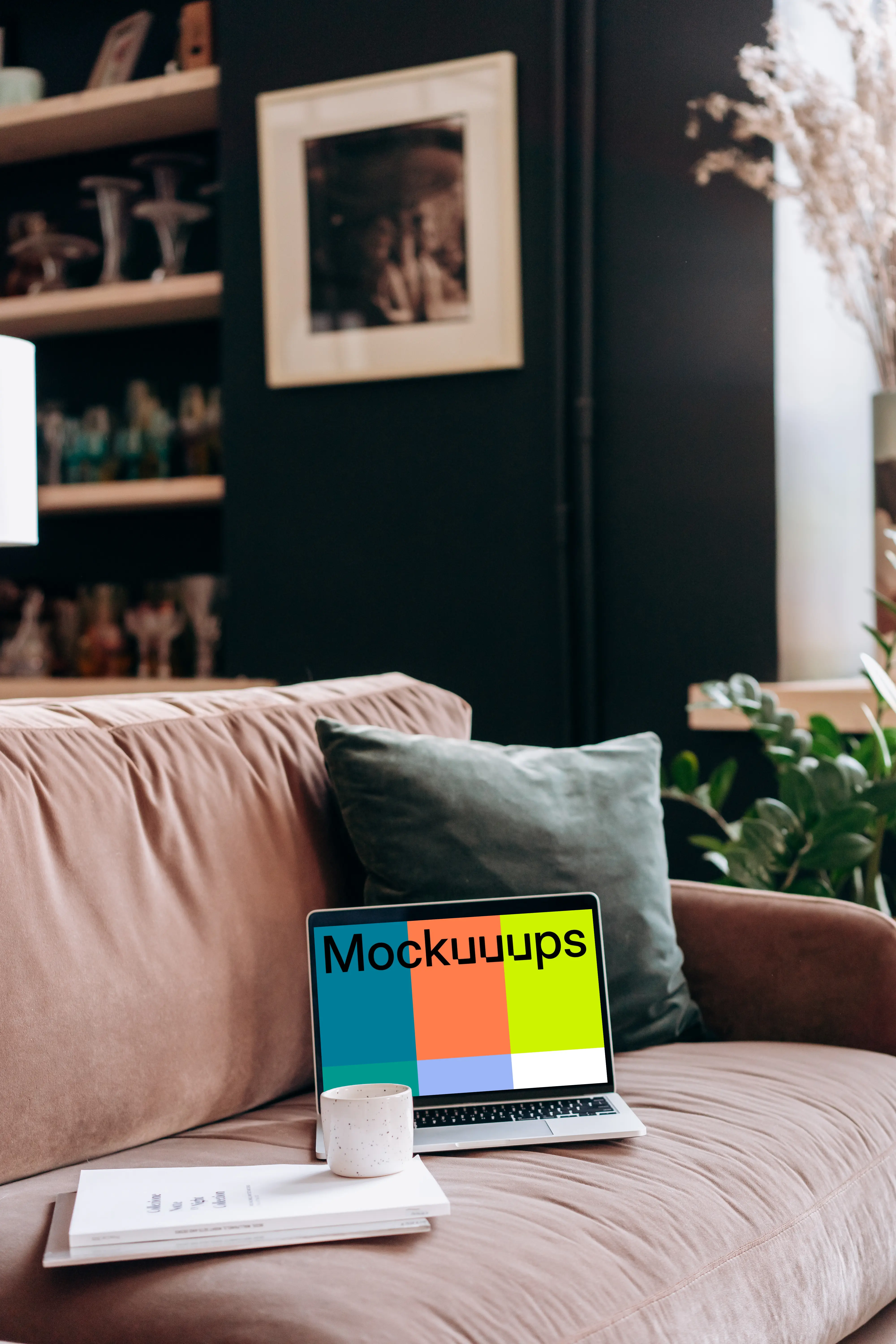 MacBook Pro mockup on a red sofa