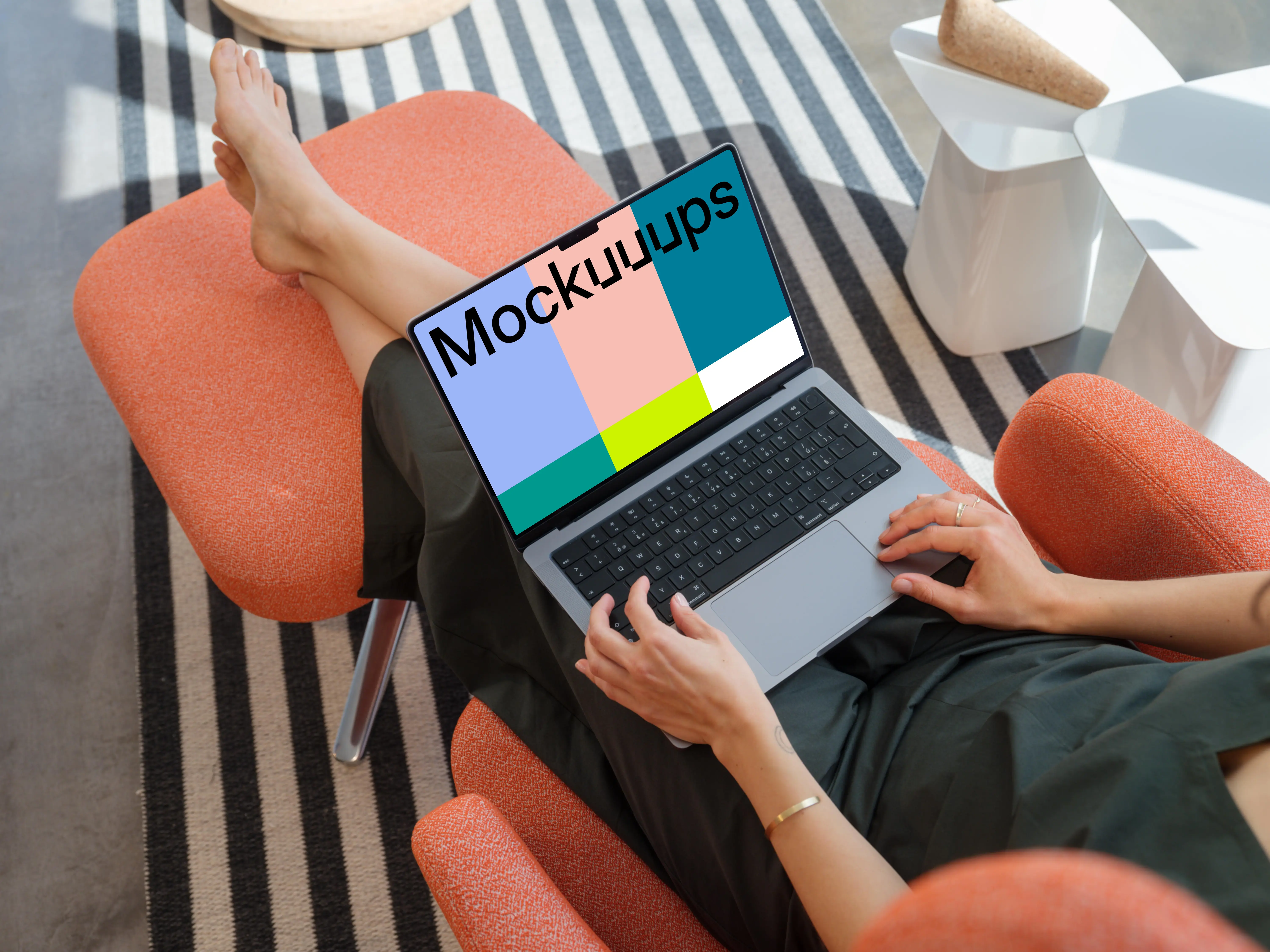 MacBook Pro mockup with a woman relaxing on a chair